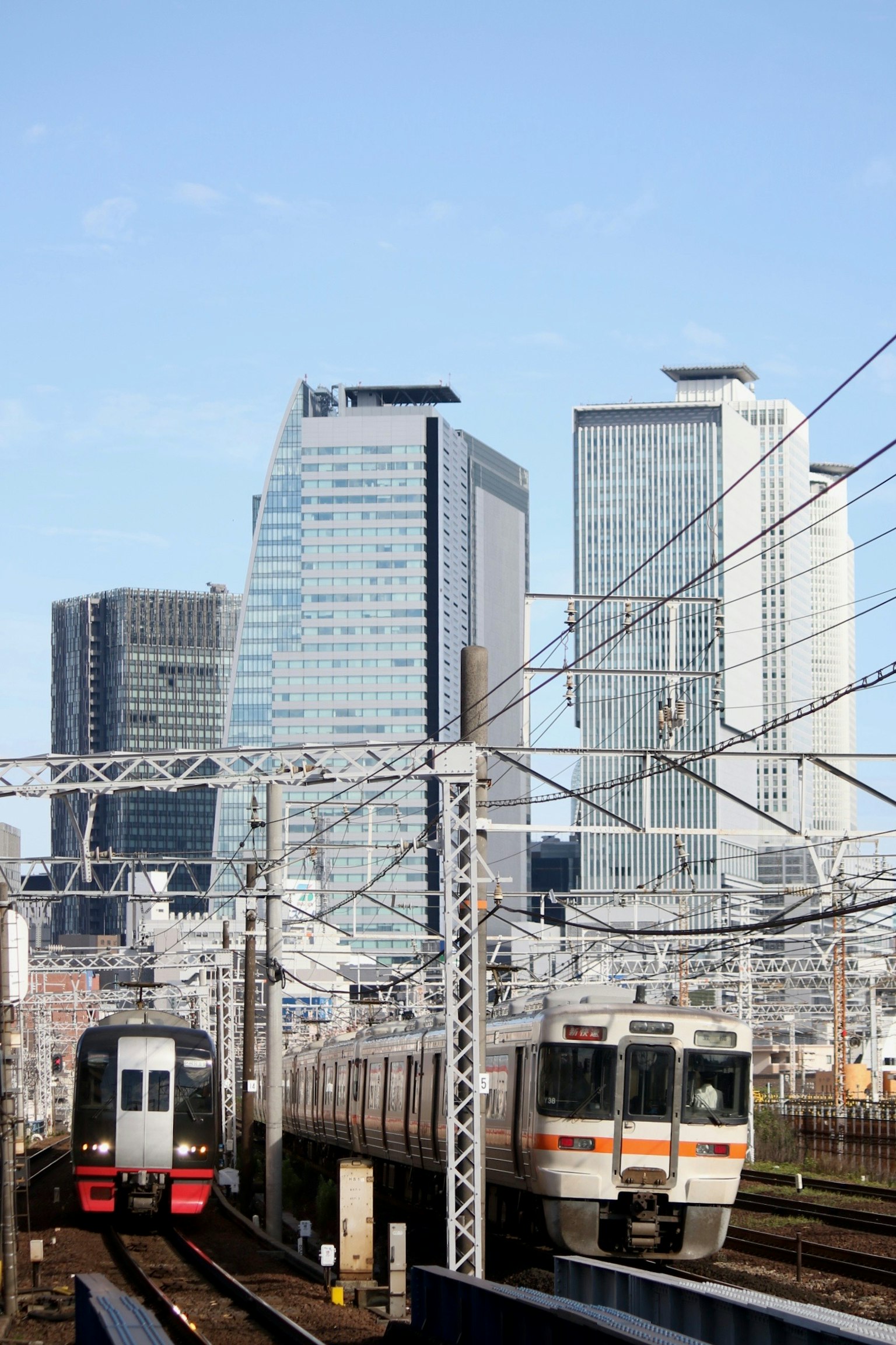 Urban landscape featuring skyscrapers and trains