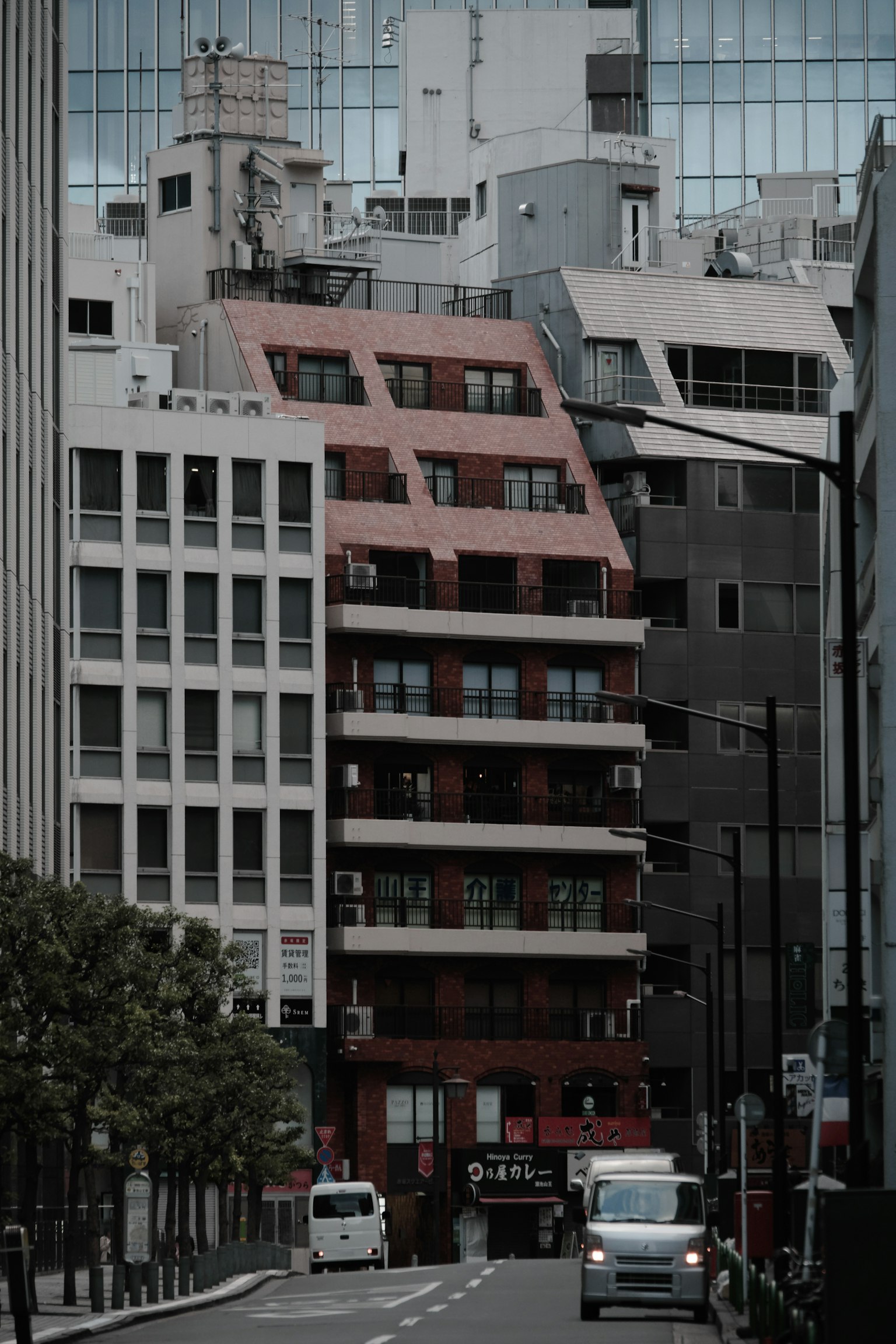 Urban landscape featuring multiple buildings with a red exterior