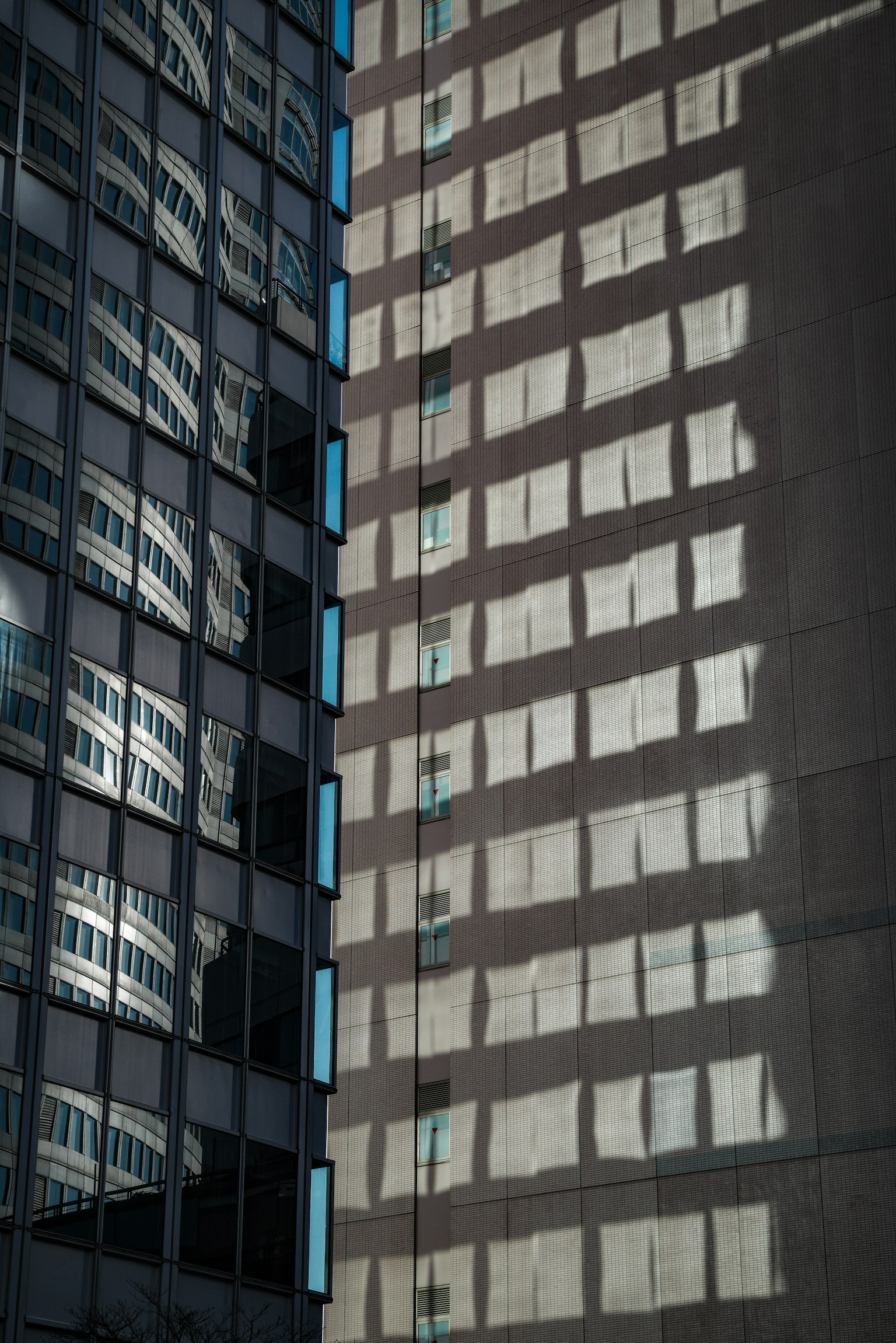 Urban scene with reflections and shadows of building windows
