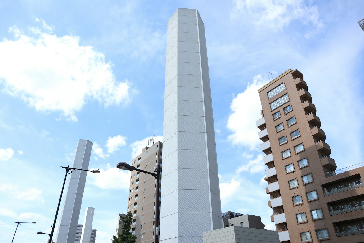 Tall buildings against a blue sky