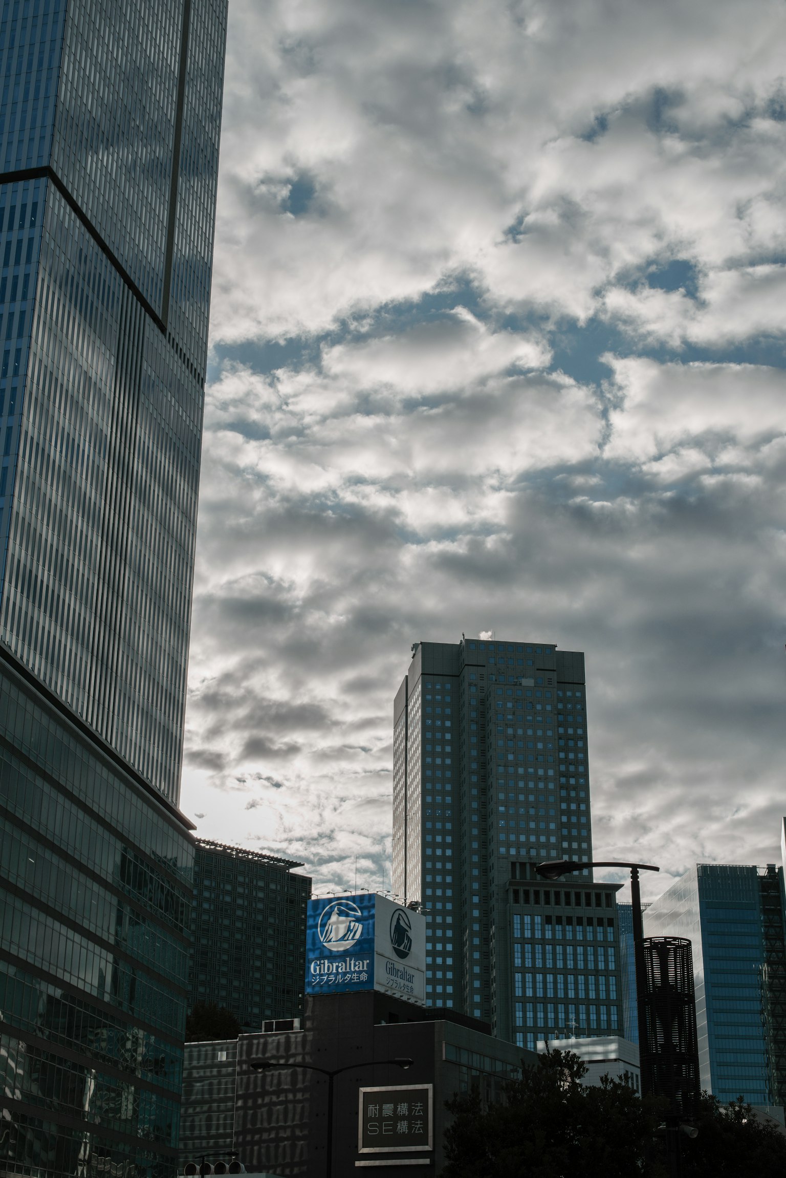 Skyline featuring tall buildings and a cloudy sky