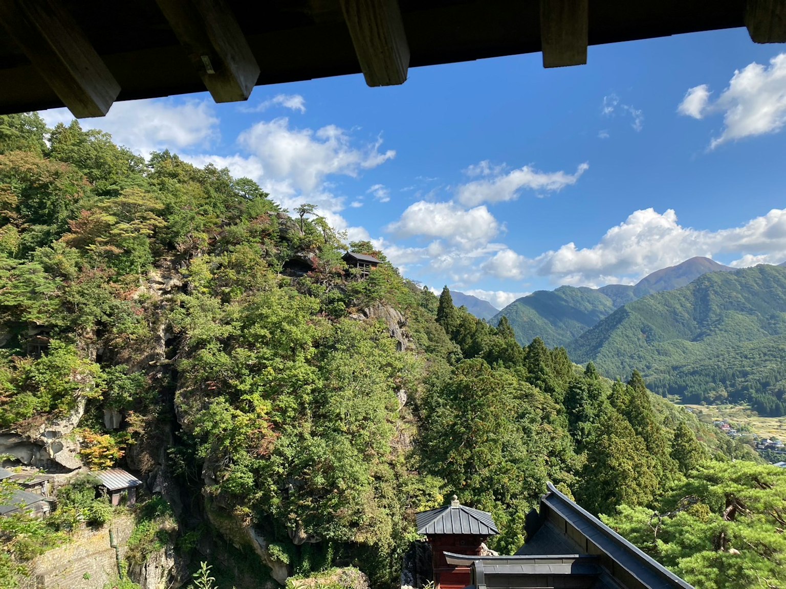 Lush green mountains under a clear blue sky