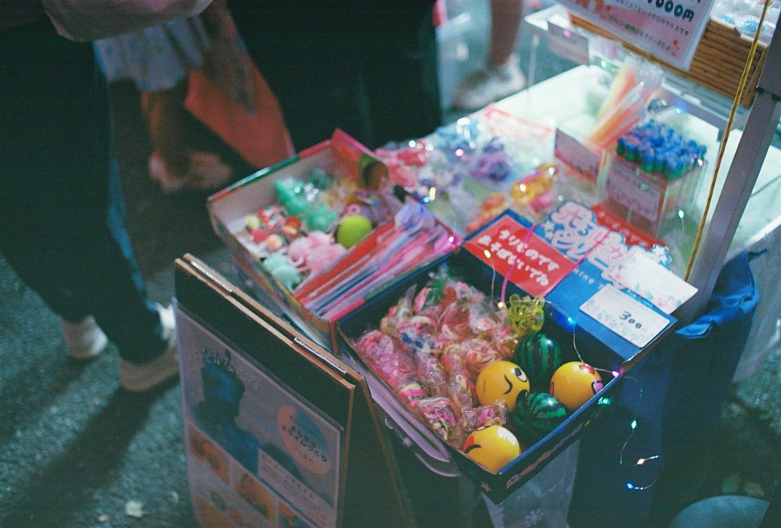 Colorful toys and trinkets displayed on a street vendor's table