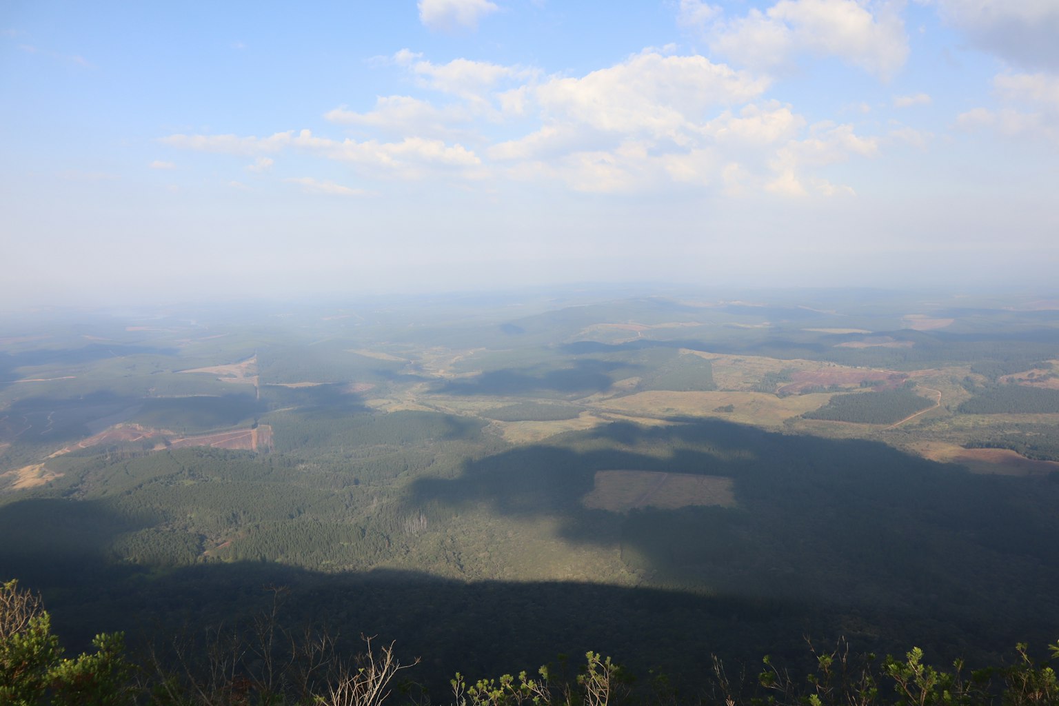 Expansive landscape view with clouds in blue sky