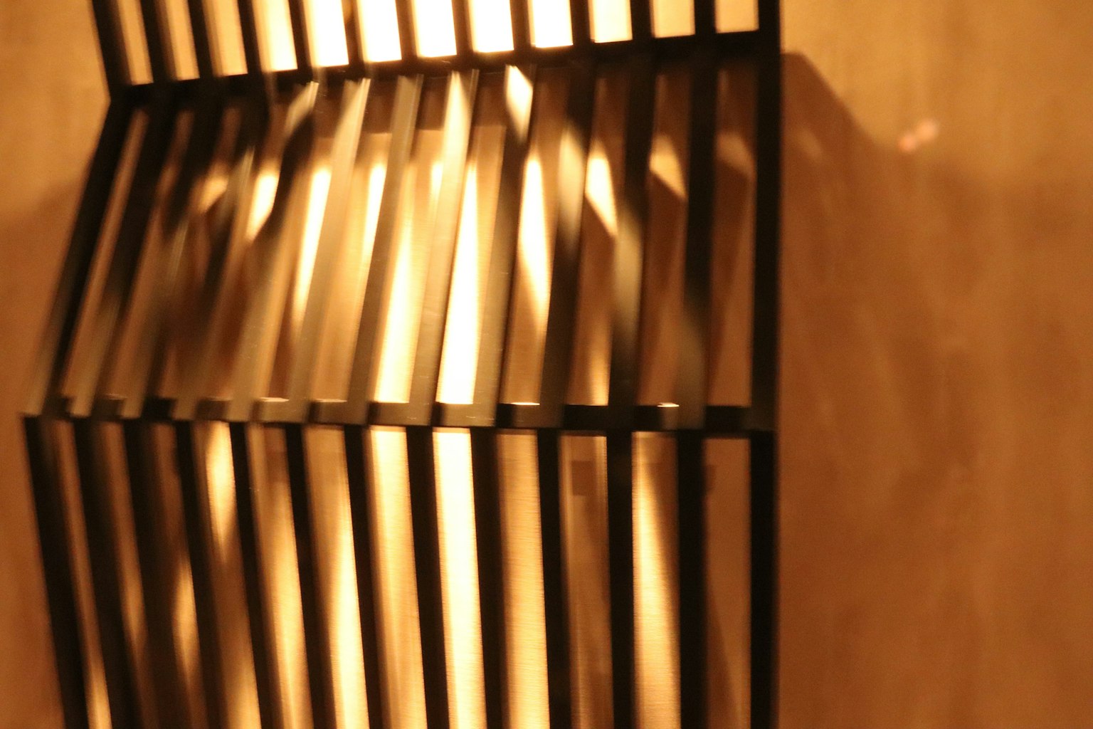 Black metal shelf with soft lighting effect in an interior space