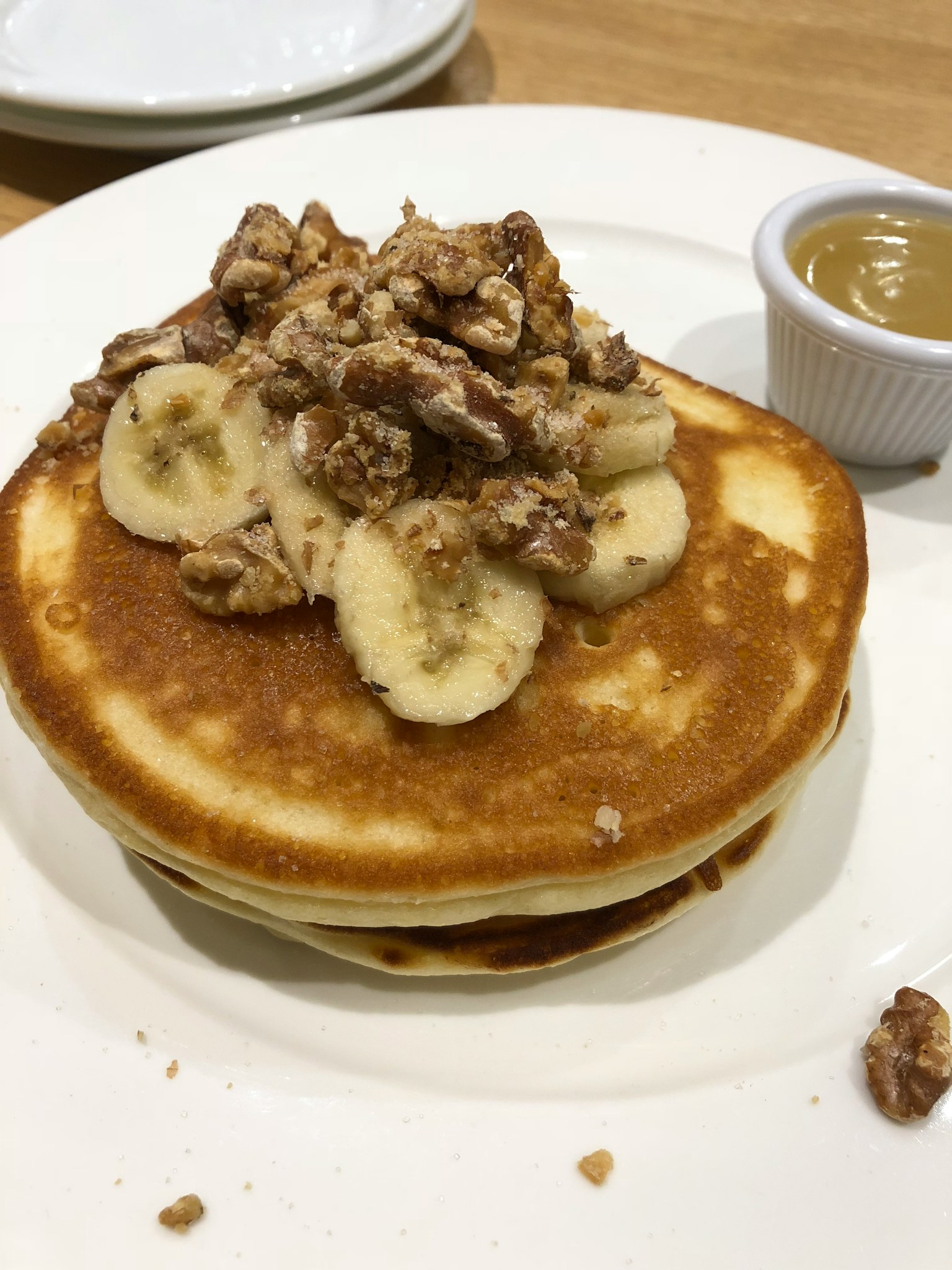 Pancake topped with banana slices and nut granola