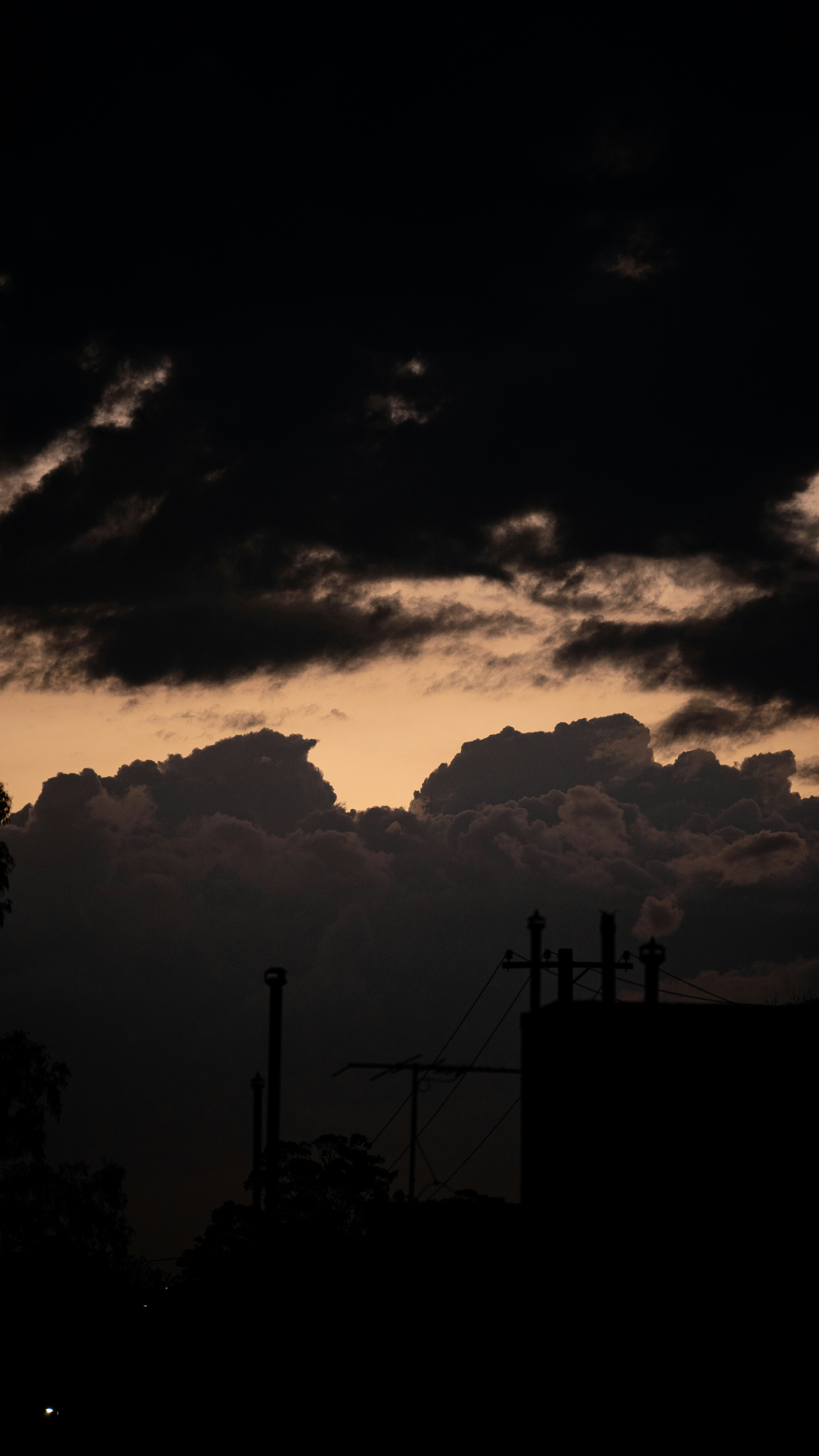 dusk clouds and silhouetted skyline