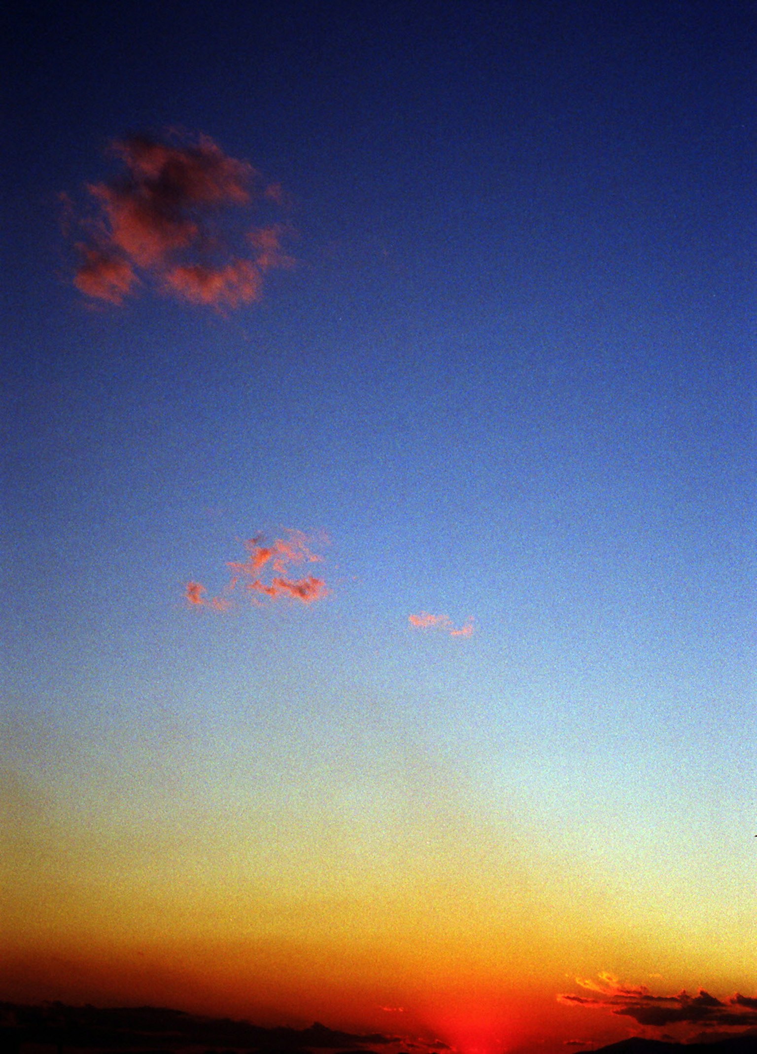Colorful sunset sky with clouds and gradient hues