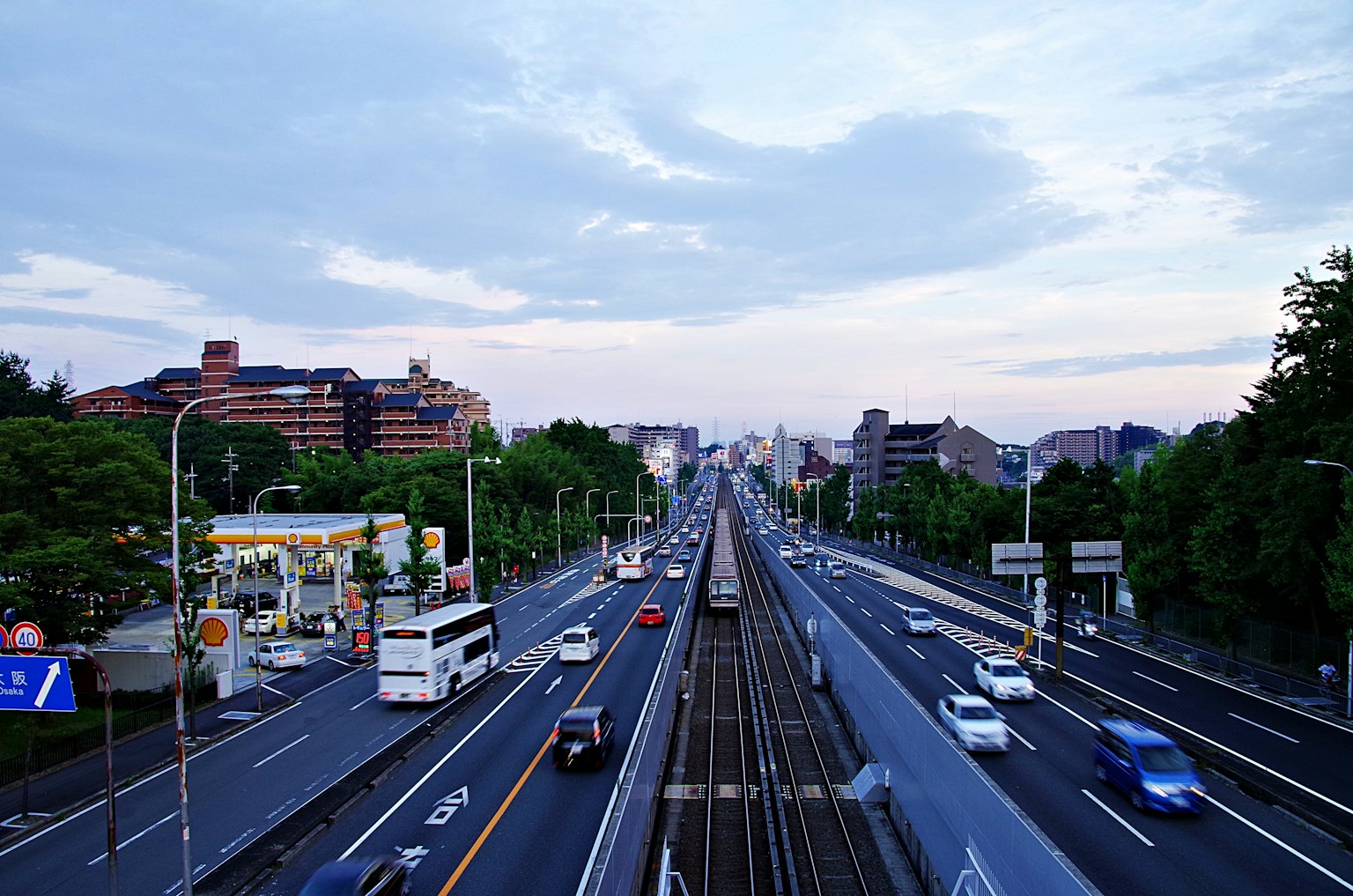 Urban landscape overlooking a wide road and flowing traffic