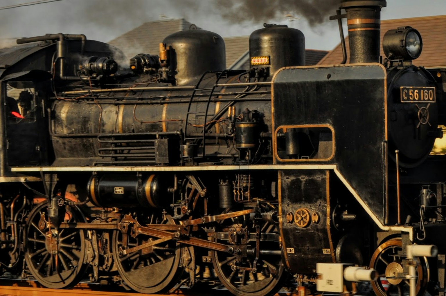 Detailed side view of an old steam locomotive