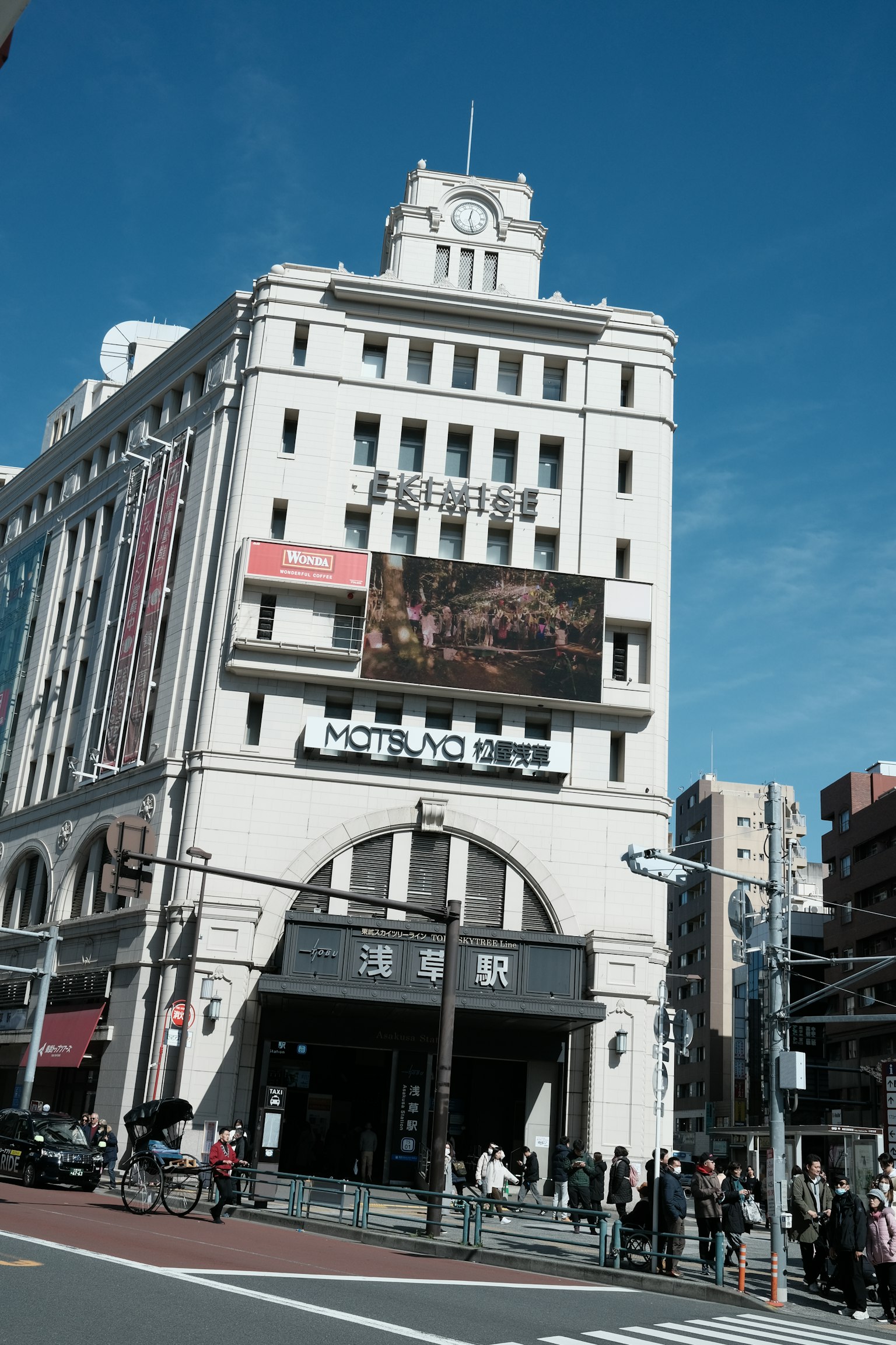 Historic building exterior with clock under blue sky