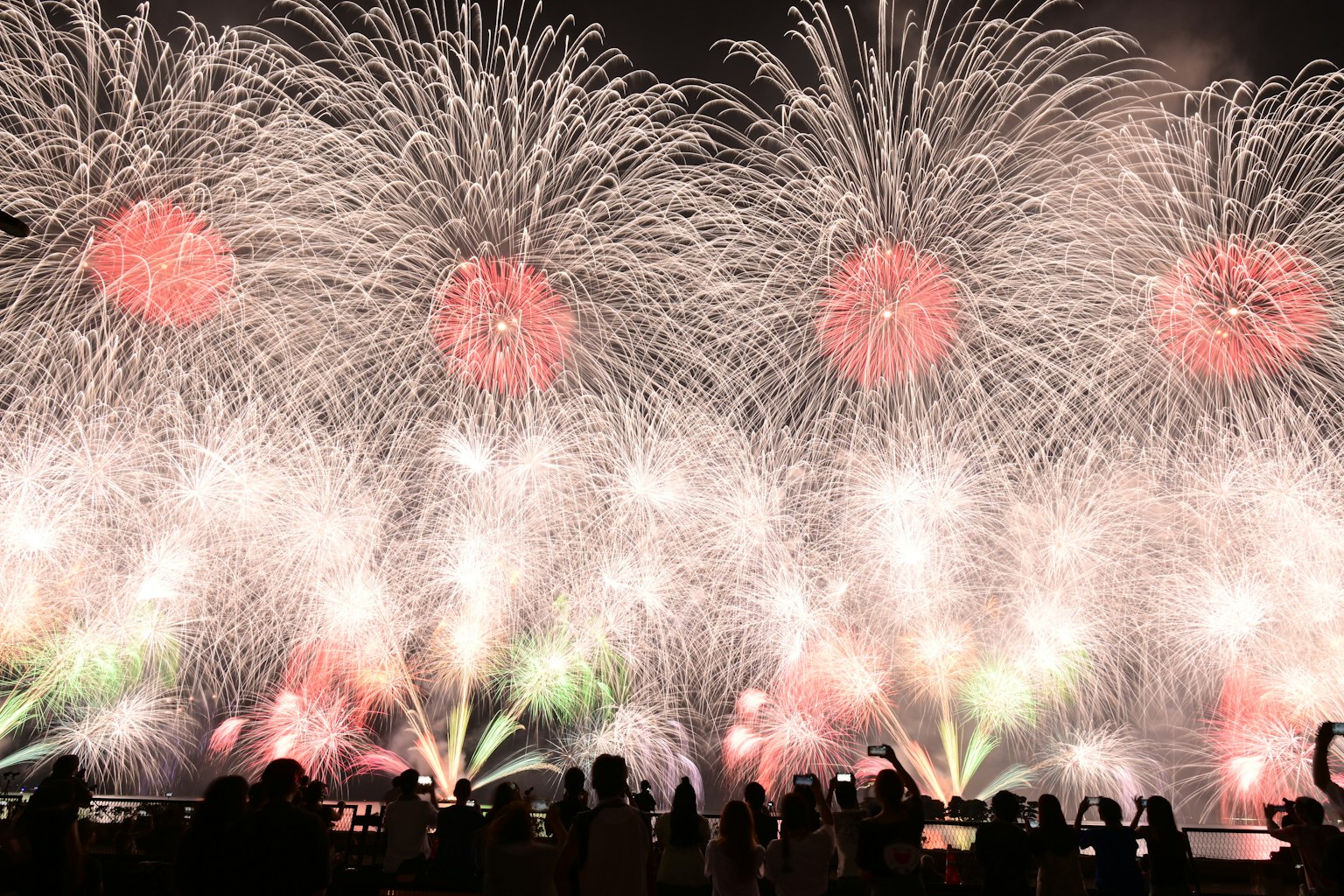 Colorful fireworks display lighting up the night sky with vibrant bursts