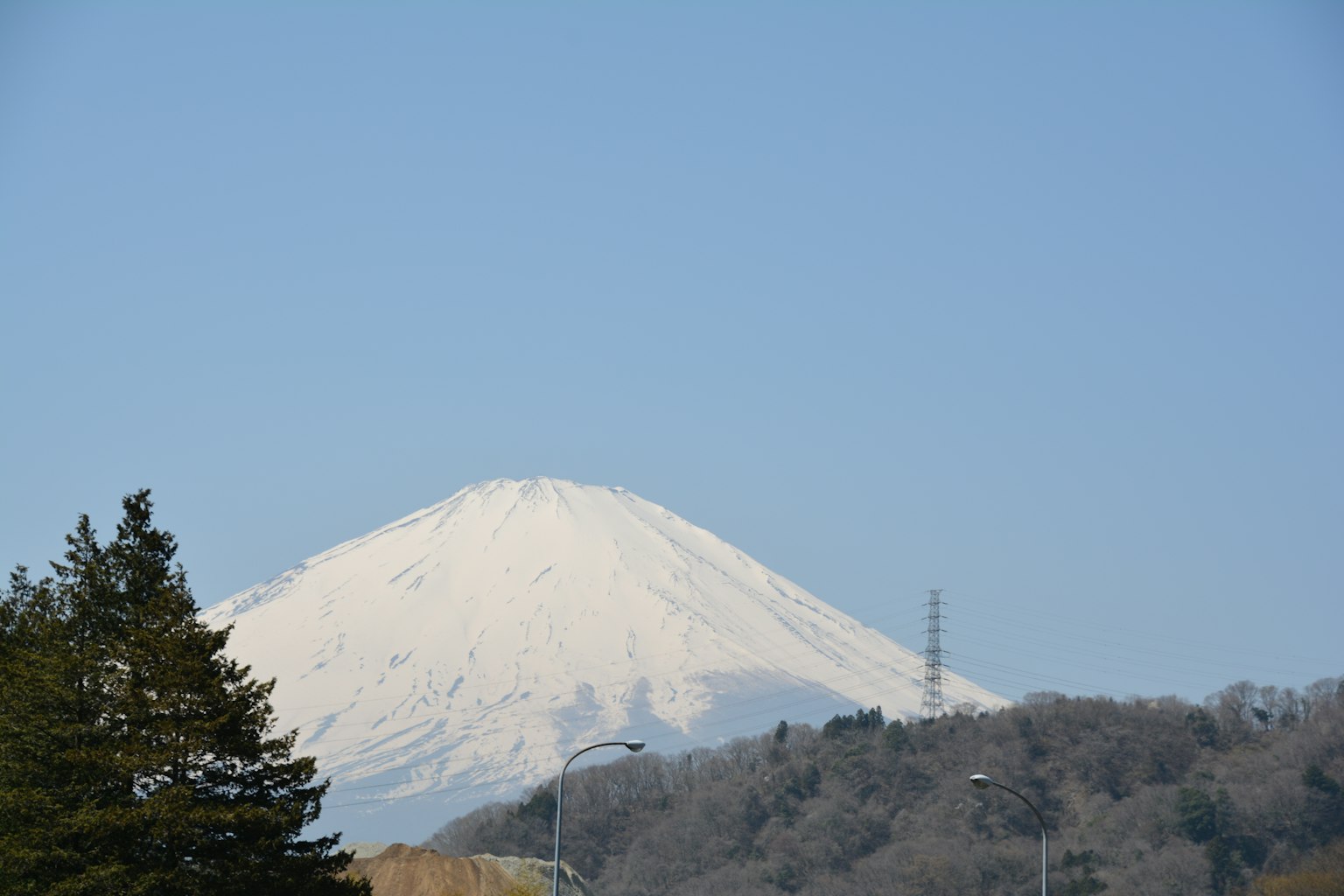 Snow-capped Mount Fuji under a clear blue sky