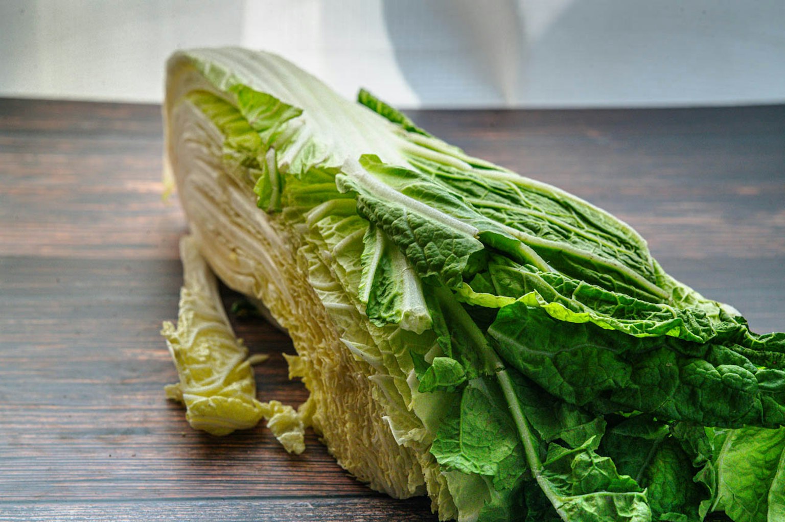 Fresh lettuce resting on a wooden table