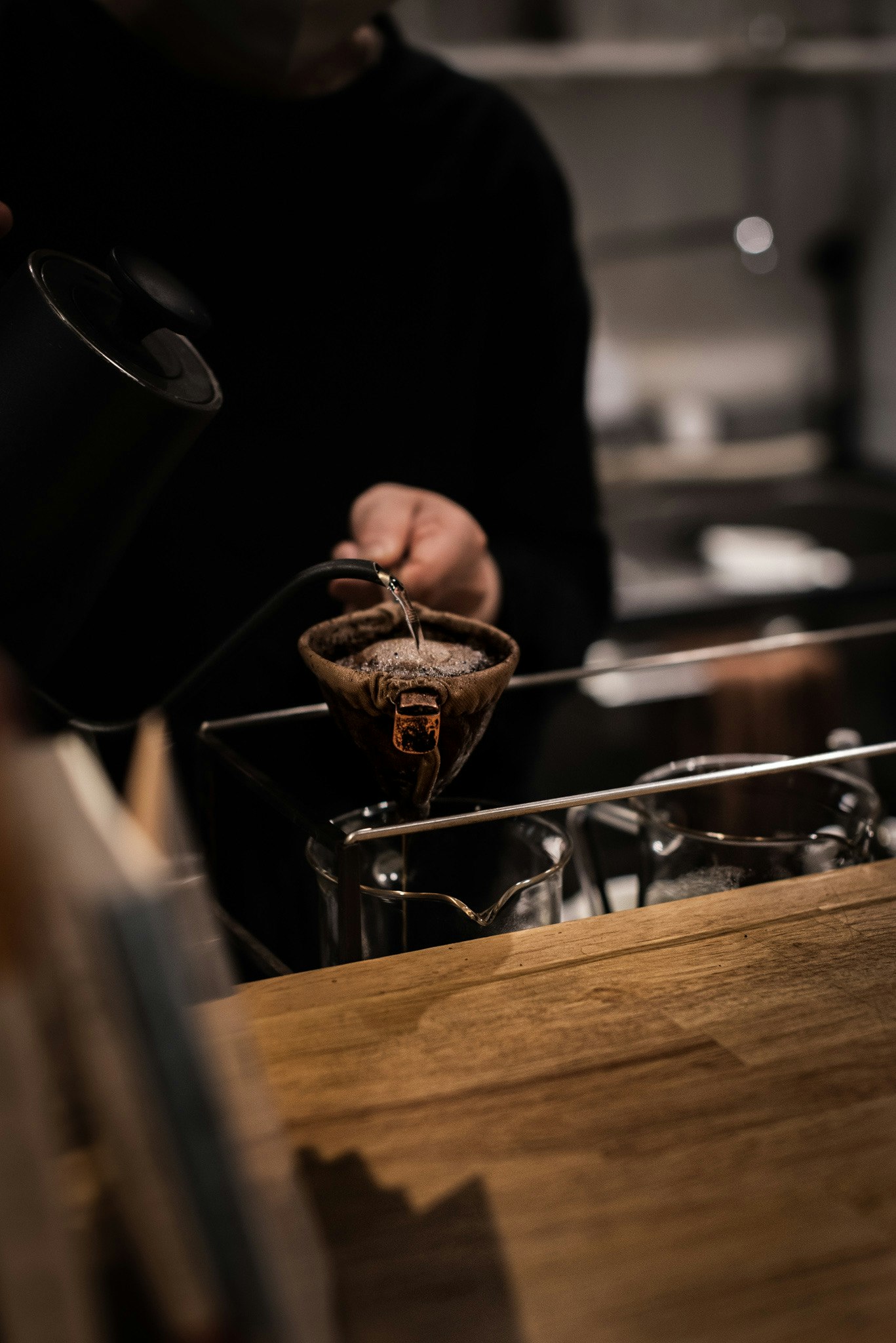 coffee roasting beans and brewing equipment in a cafe work scene