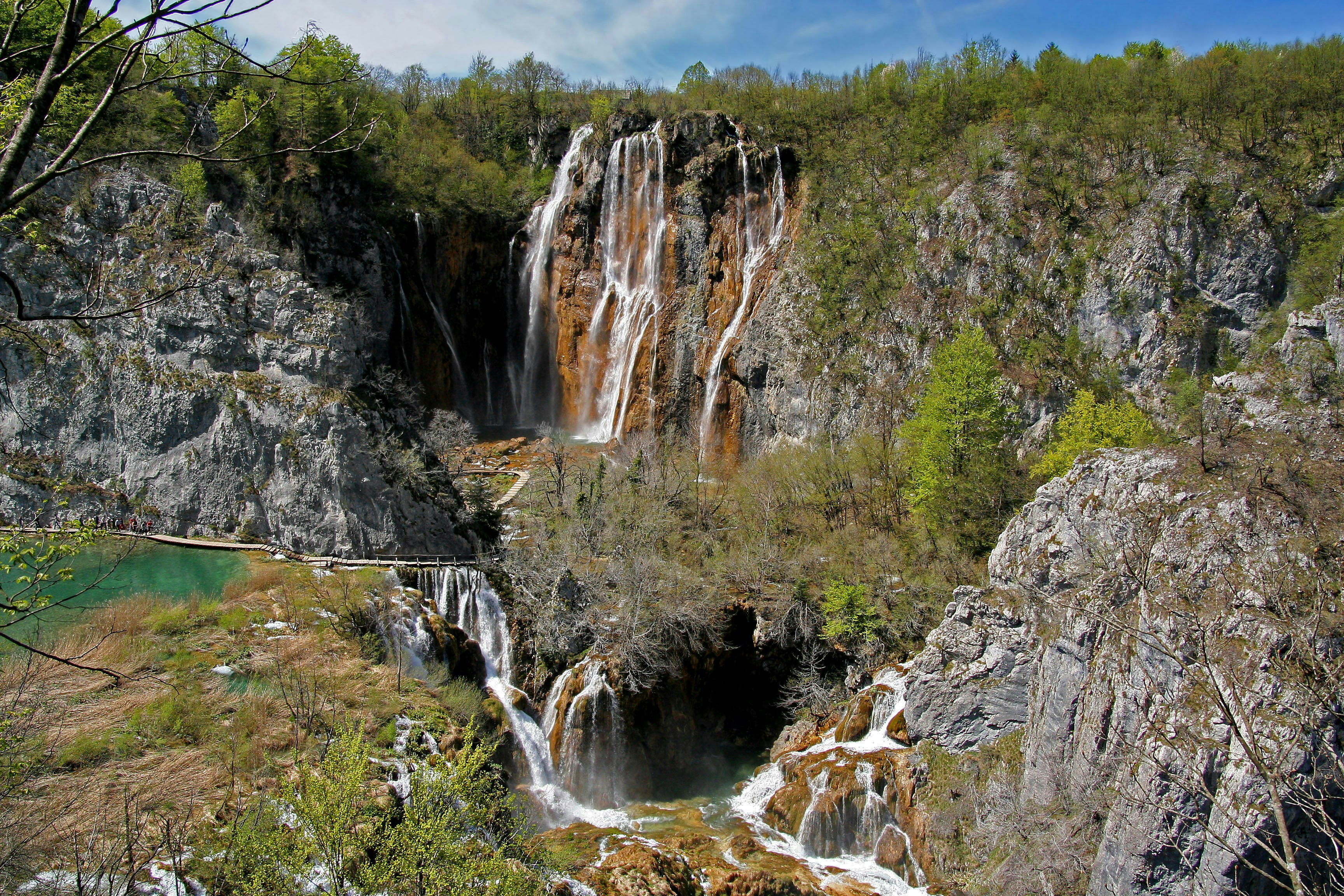 waterfalls cascading down rocky cliffs in a valley landscape