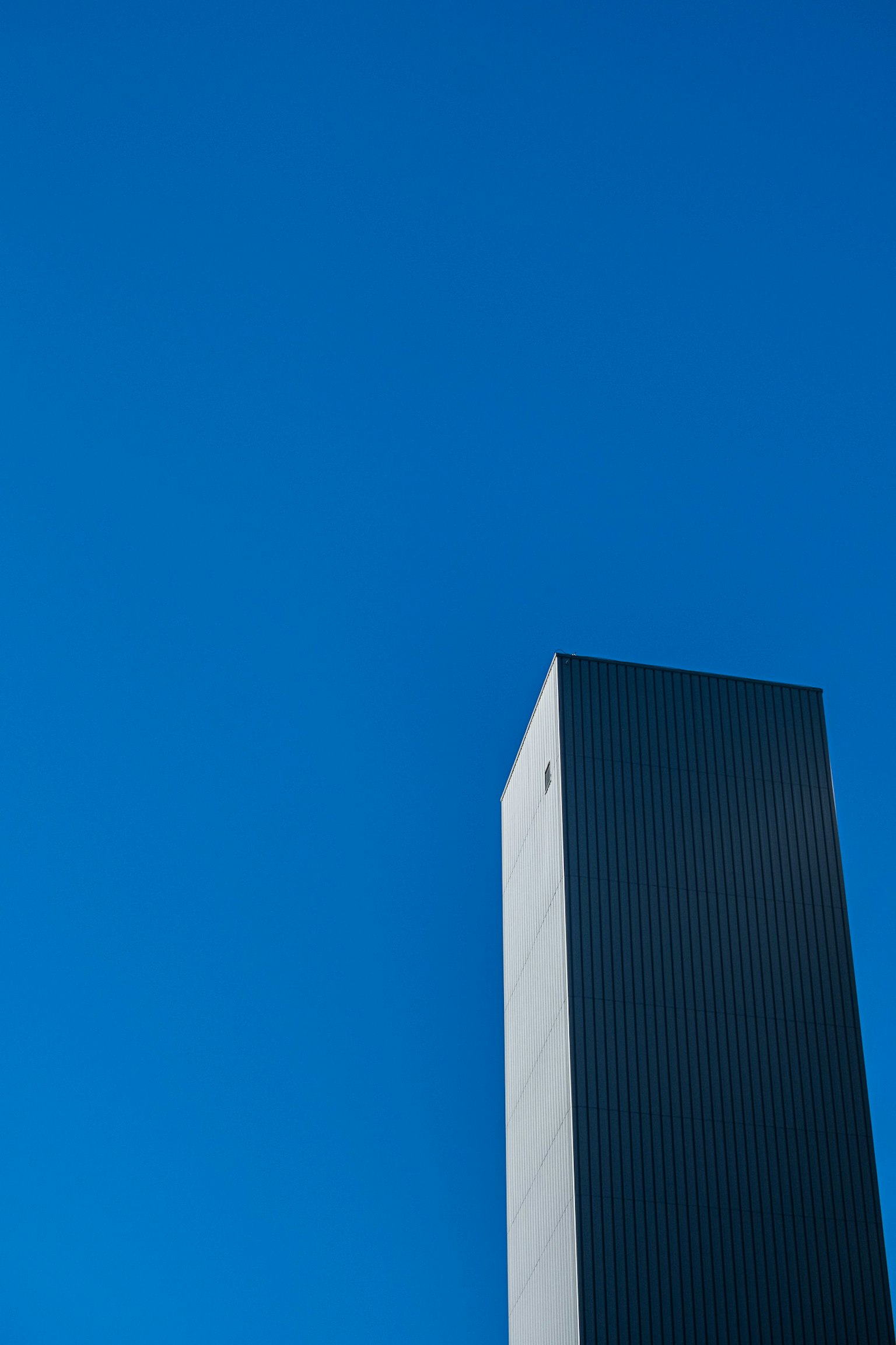 Tall building against a clear blue sky