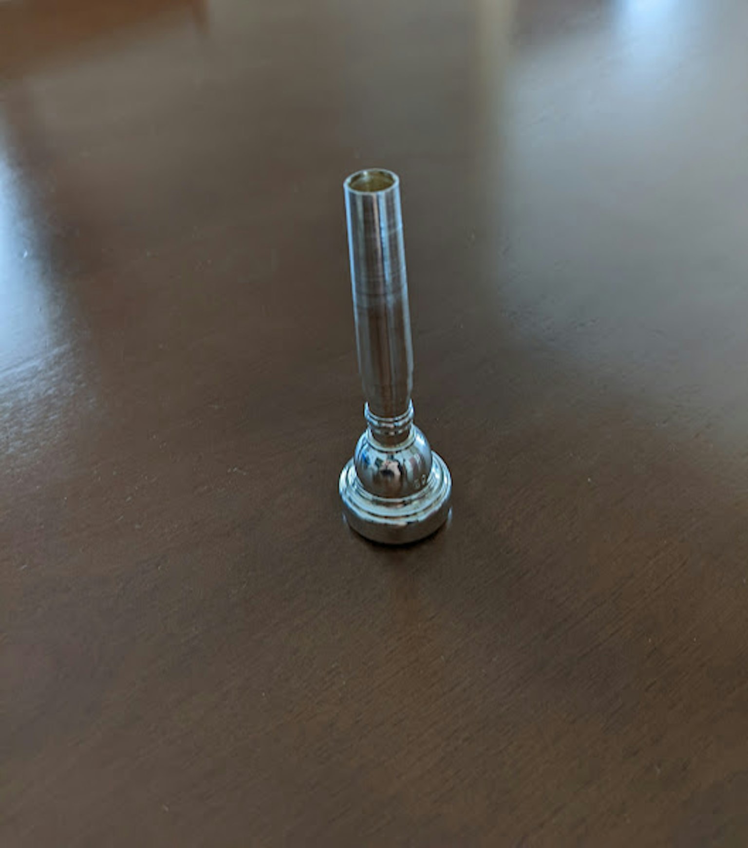 Metal part placed on a wooden table