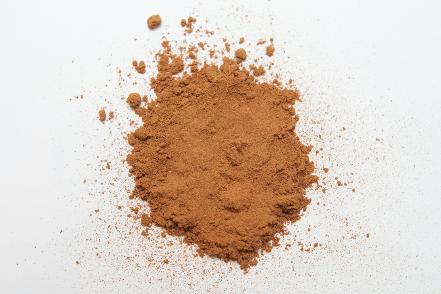 Brown powder spread on a white background