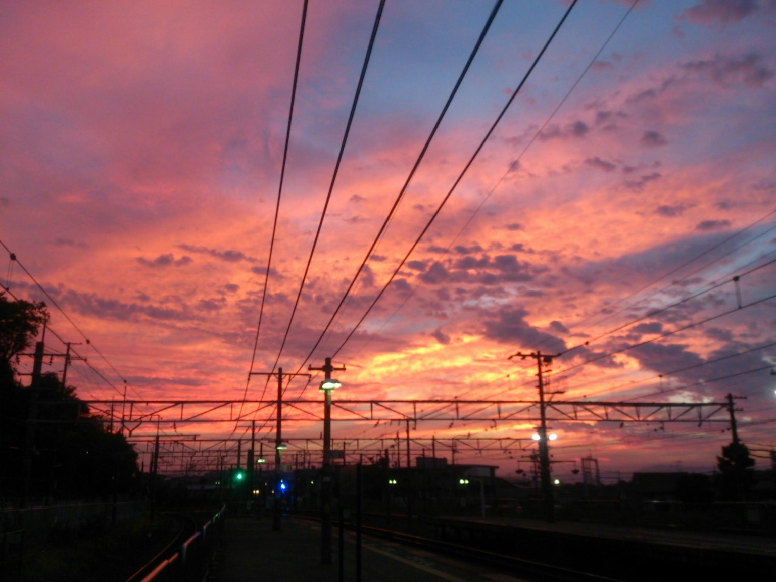 Beautiful sunset sky with train tracks visible
