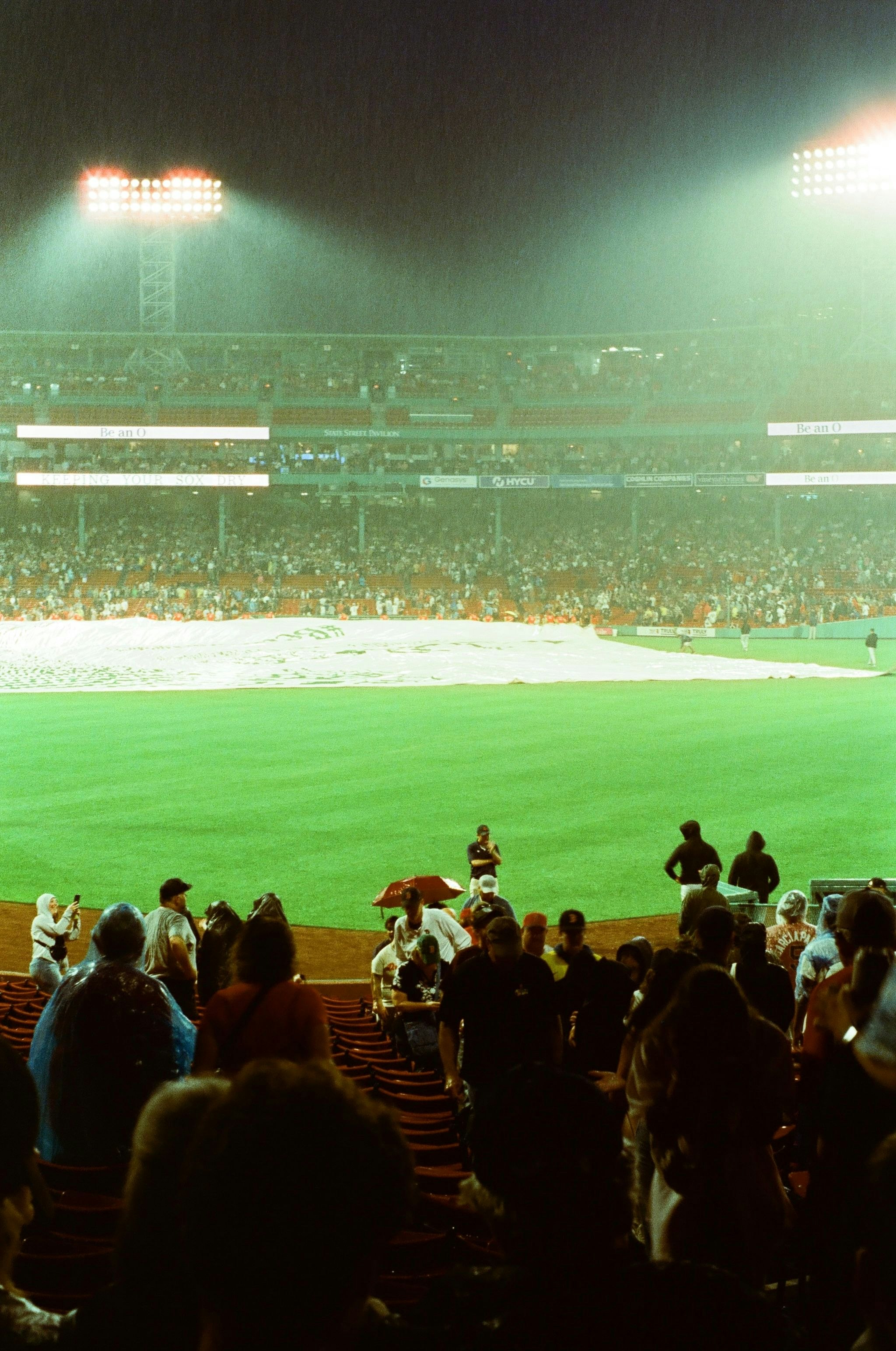 stadium stands and green field with spectators