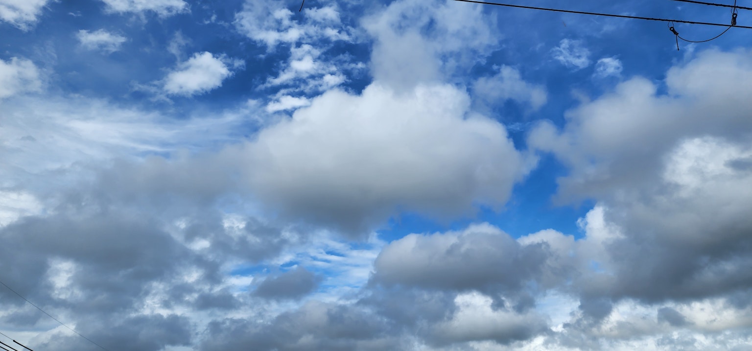 A scenic view of blue sky with white clouds