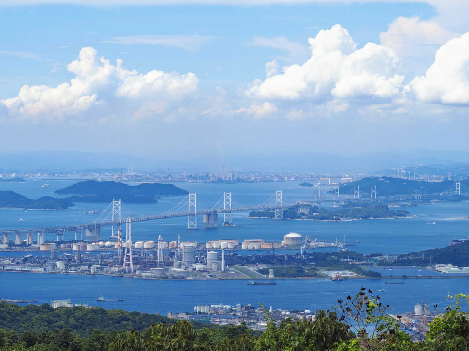 Scenic view of blue sea and sky with bridges and islands