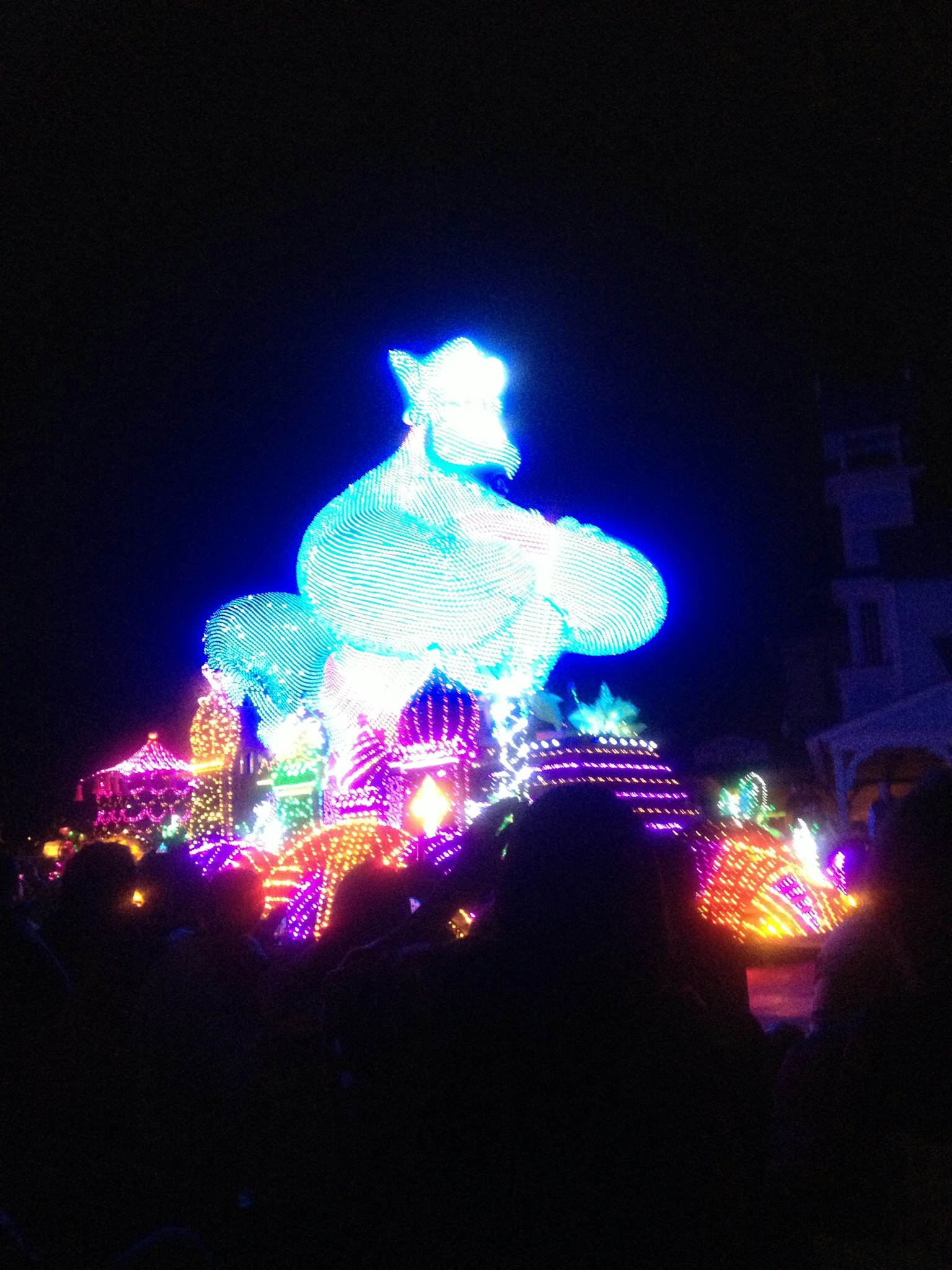 Colorful illuminated display at night featuring a large blue star-shaped object