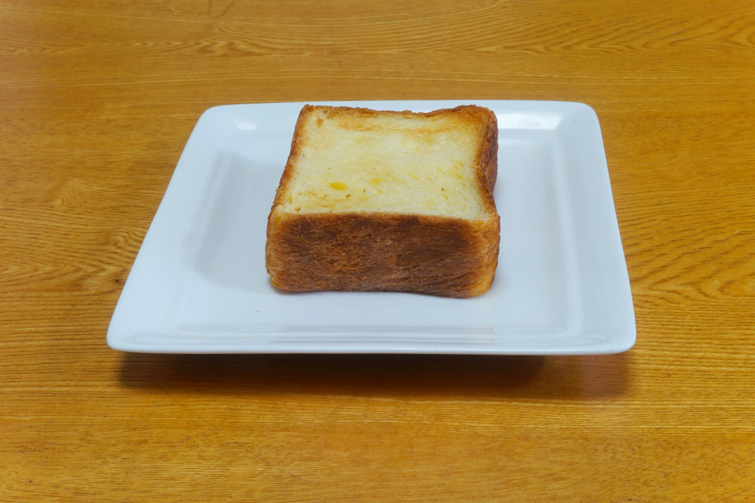 Square toast on a white plate
