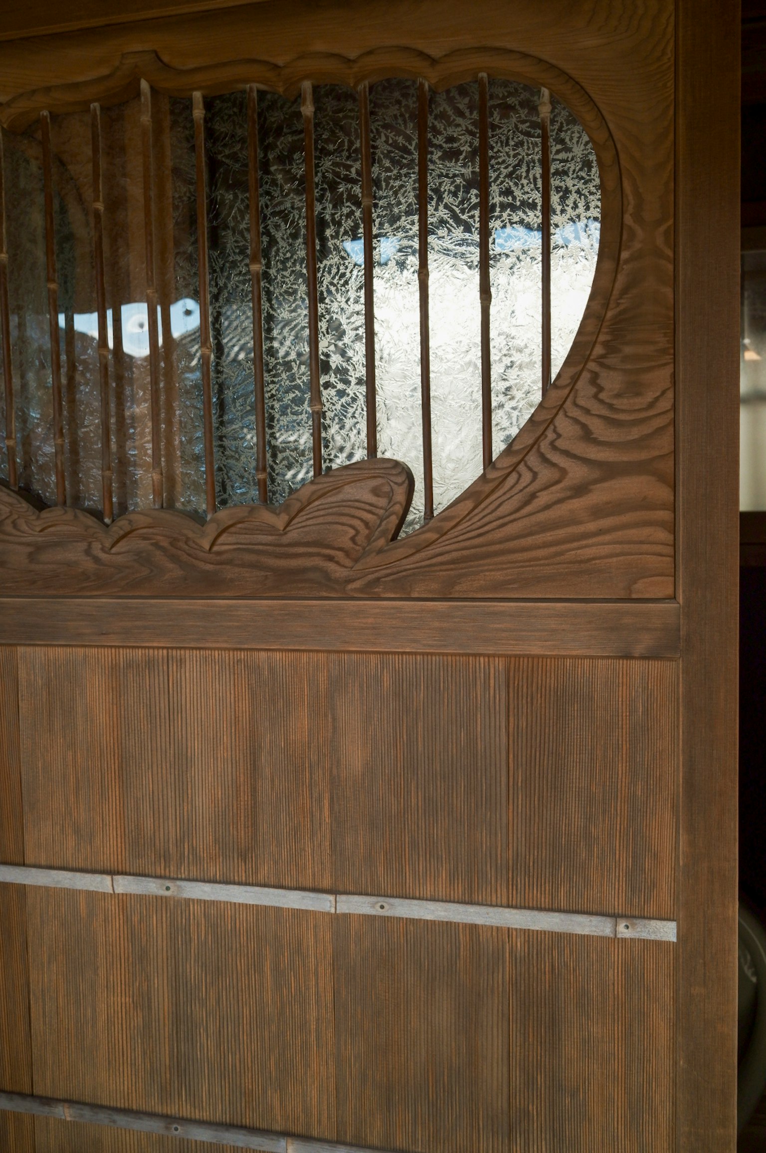 Decorative wooden door with ornate glass featuring a unique design