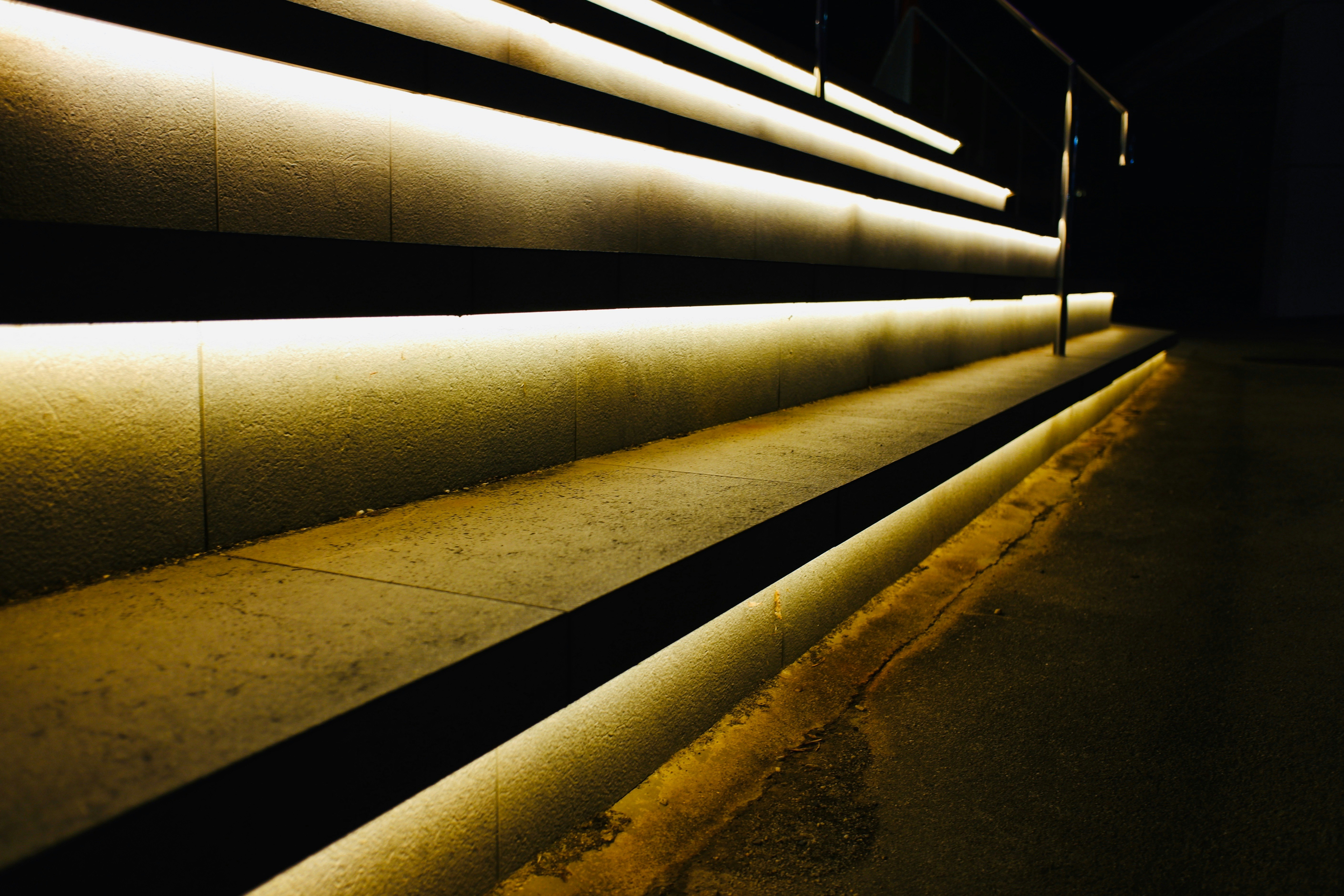 indirect light lines along the dark corridor wall