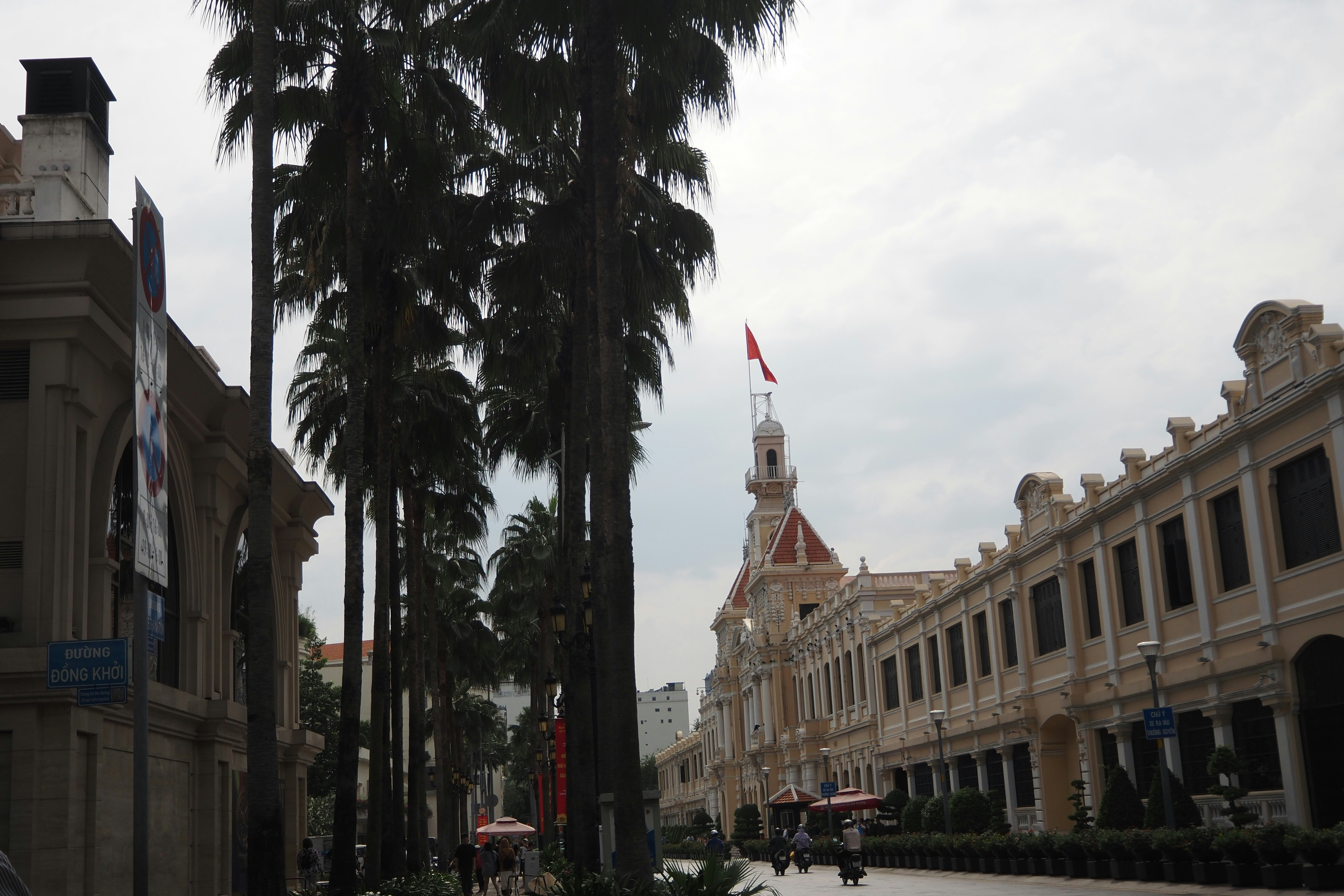 historic arcade street scene with palm trees
