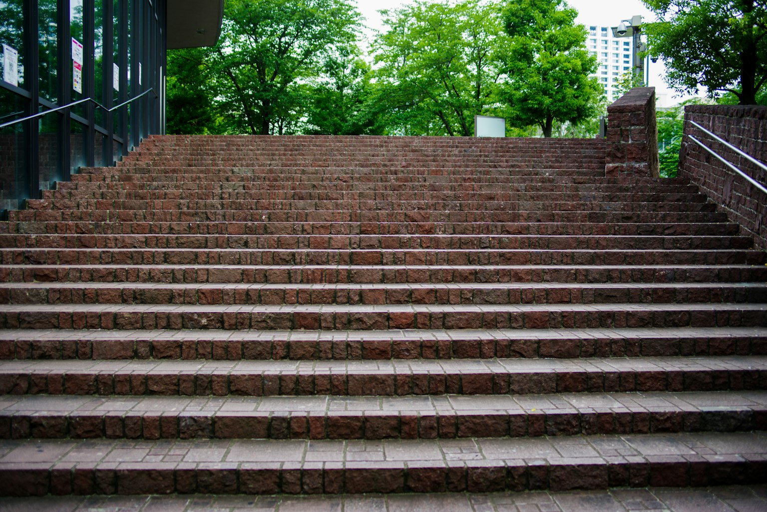 Brick staircase surrounded by green trees