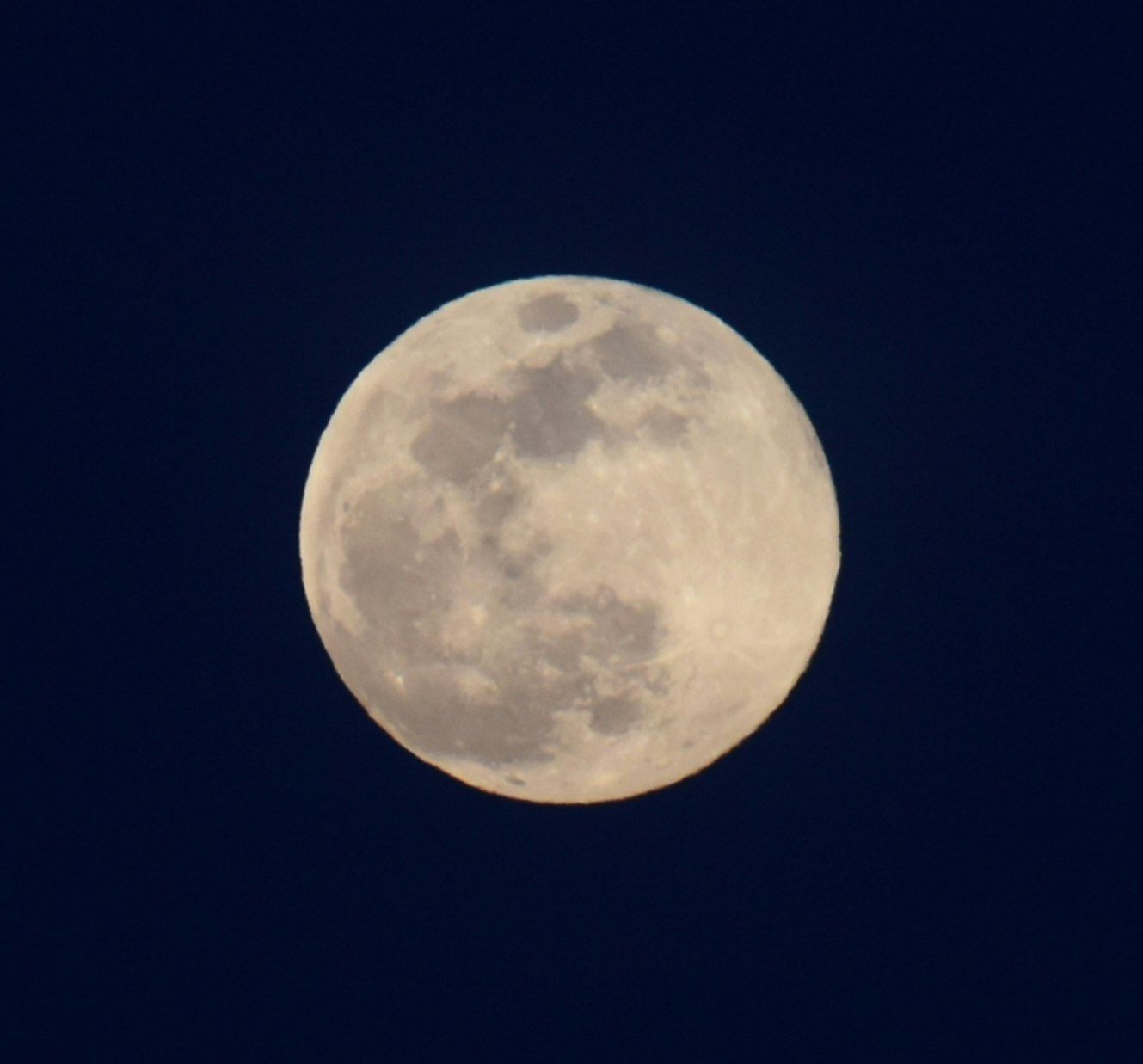 Full moon in a dark night sky