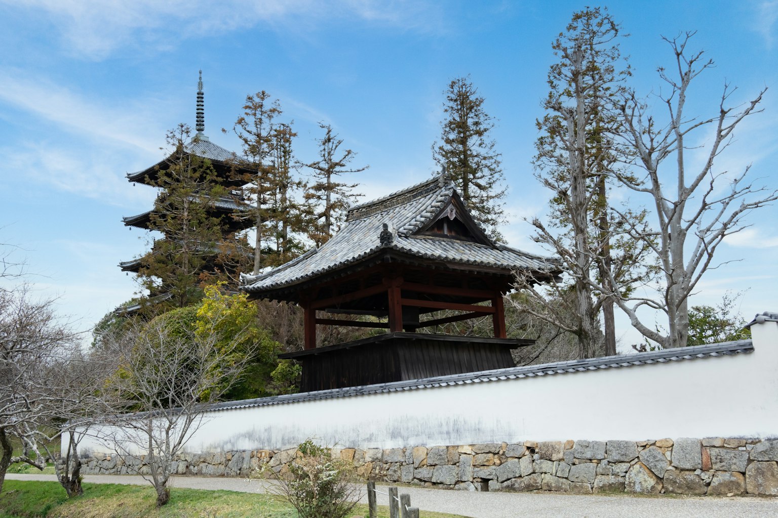 Scenic view of a Japanese temple and pagoda against a blue sky