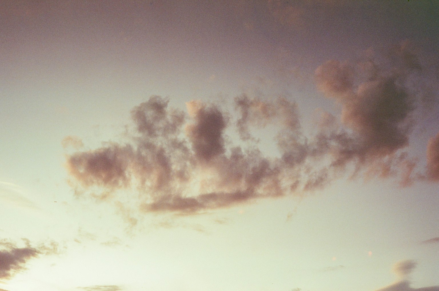 Soft clouds floating in a sunset sky