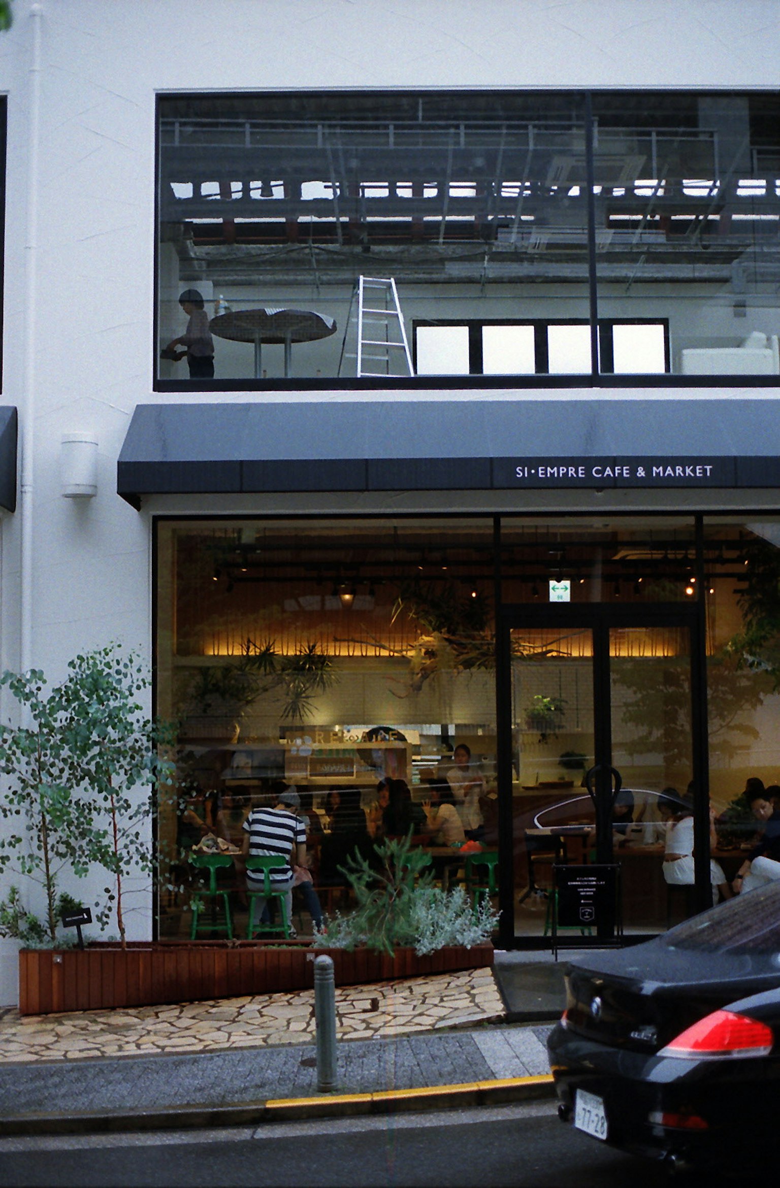 Exterior view of a café with people inside