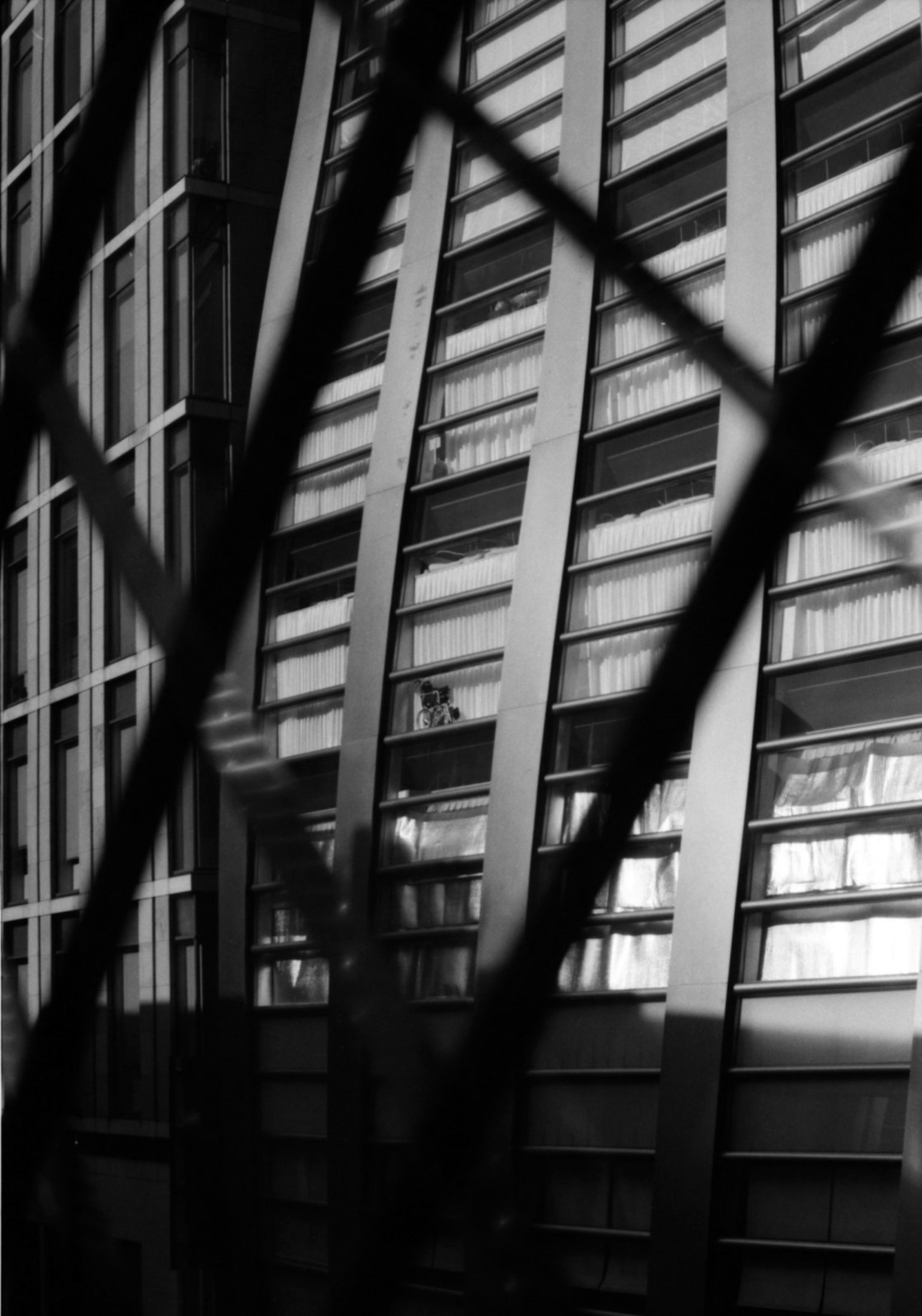 Diagonal lines emphasize the exterior of a black and white building