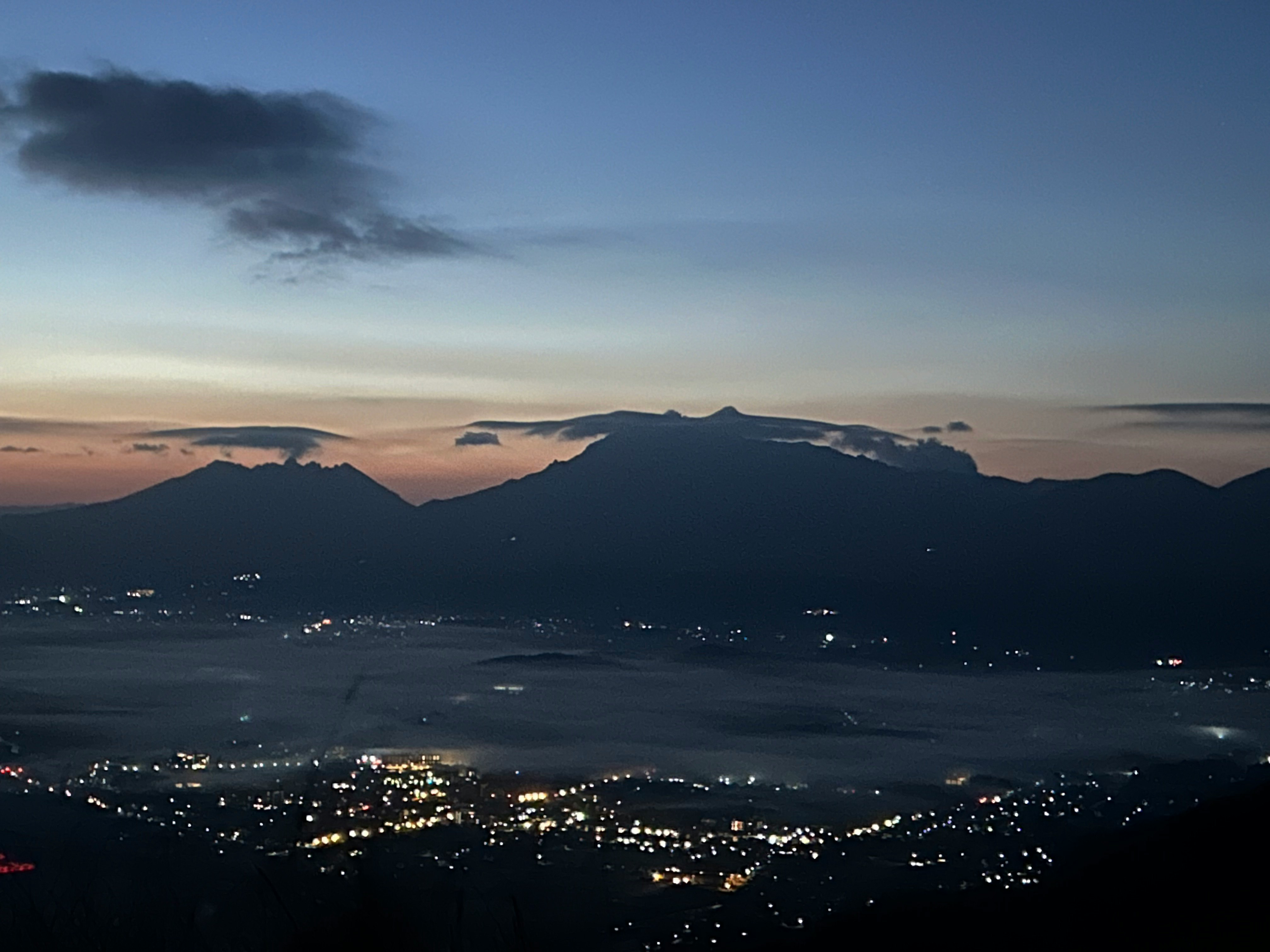 Winter night seascape with mountain silhouettes over Kyushu scenic road