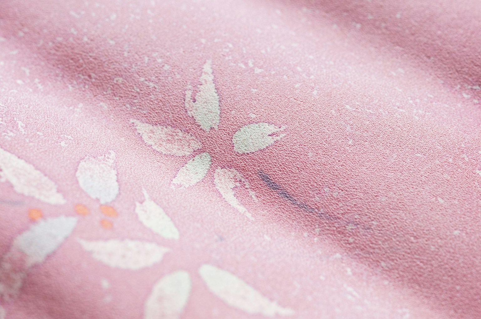 Light pink fabric with white floral patterns