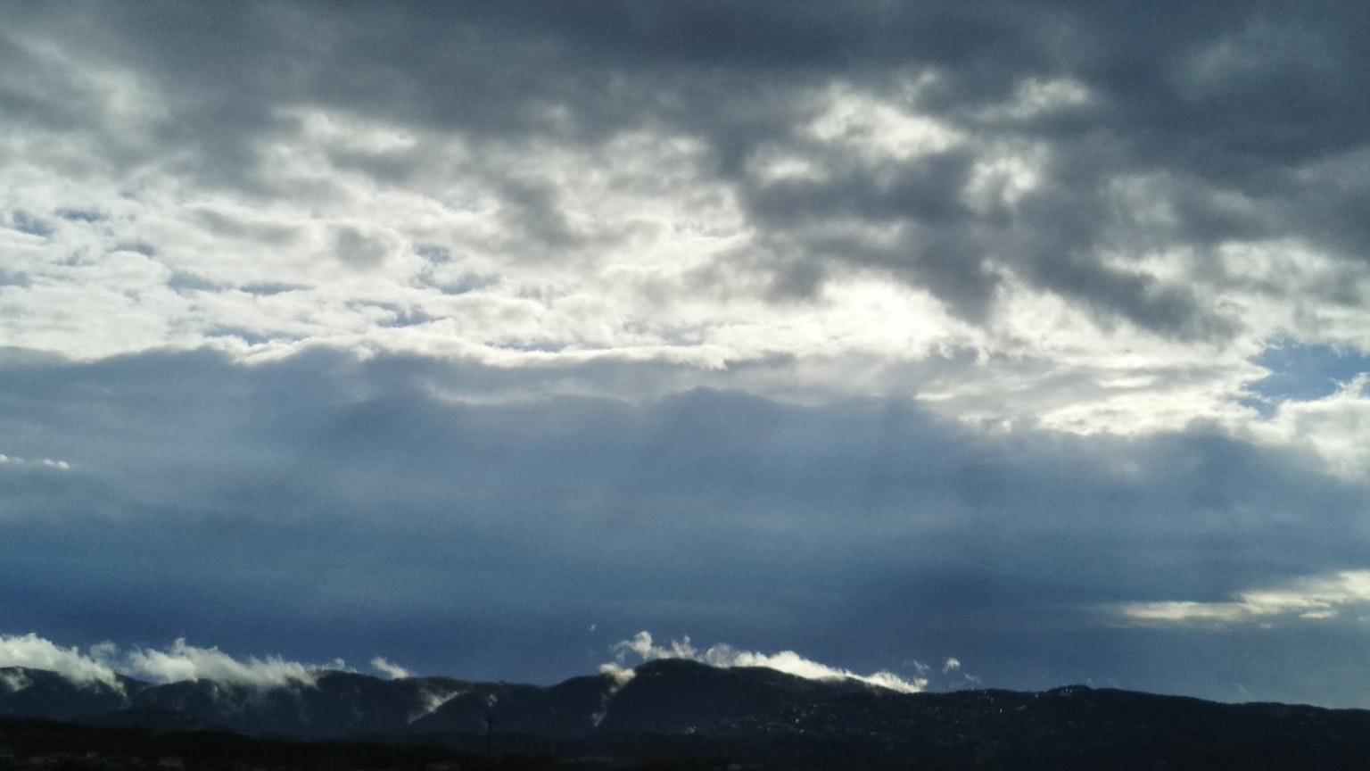 Landscape with dark clouds and mountains