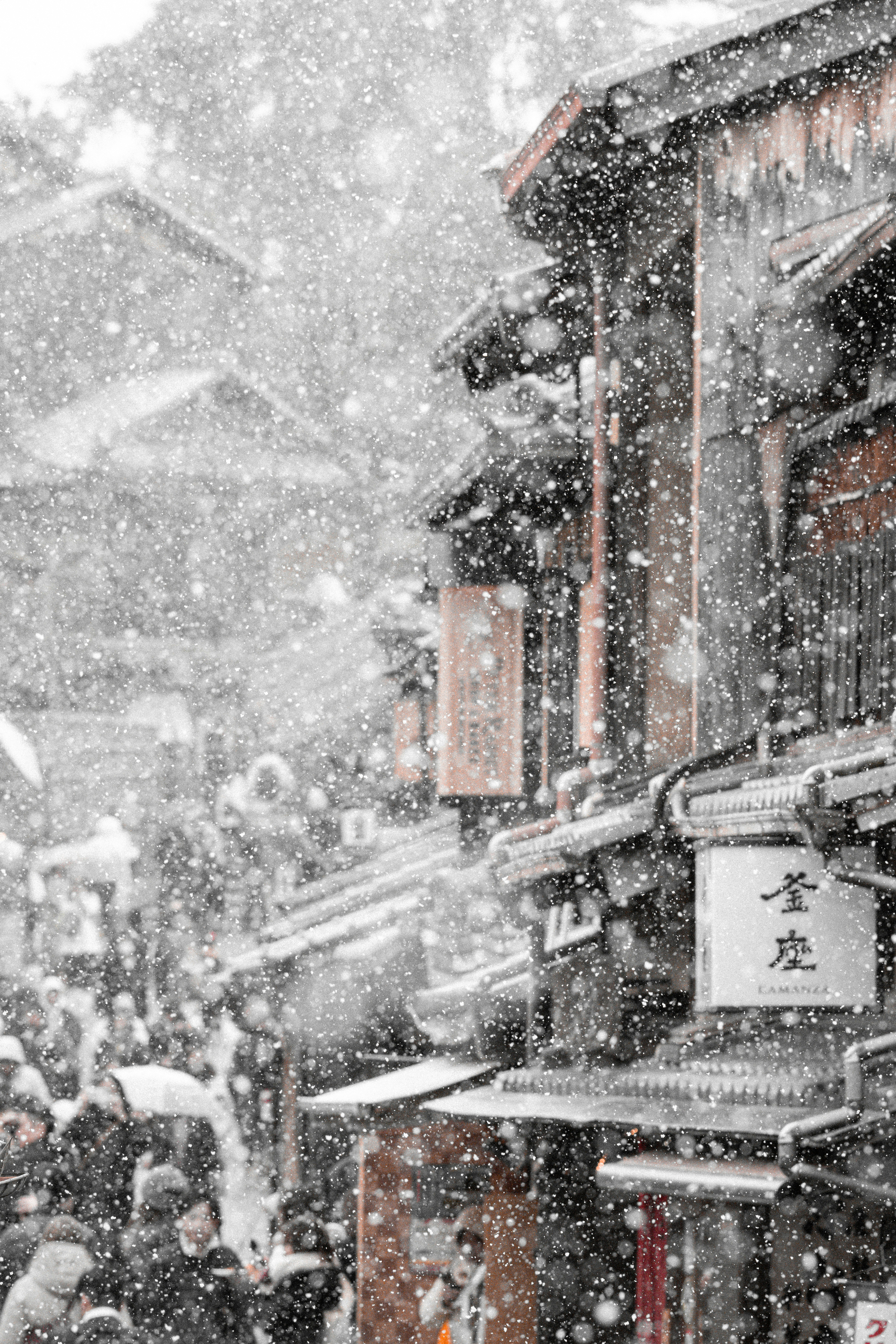 Kyoto street scene with falling snow