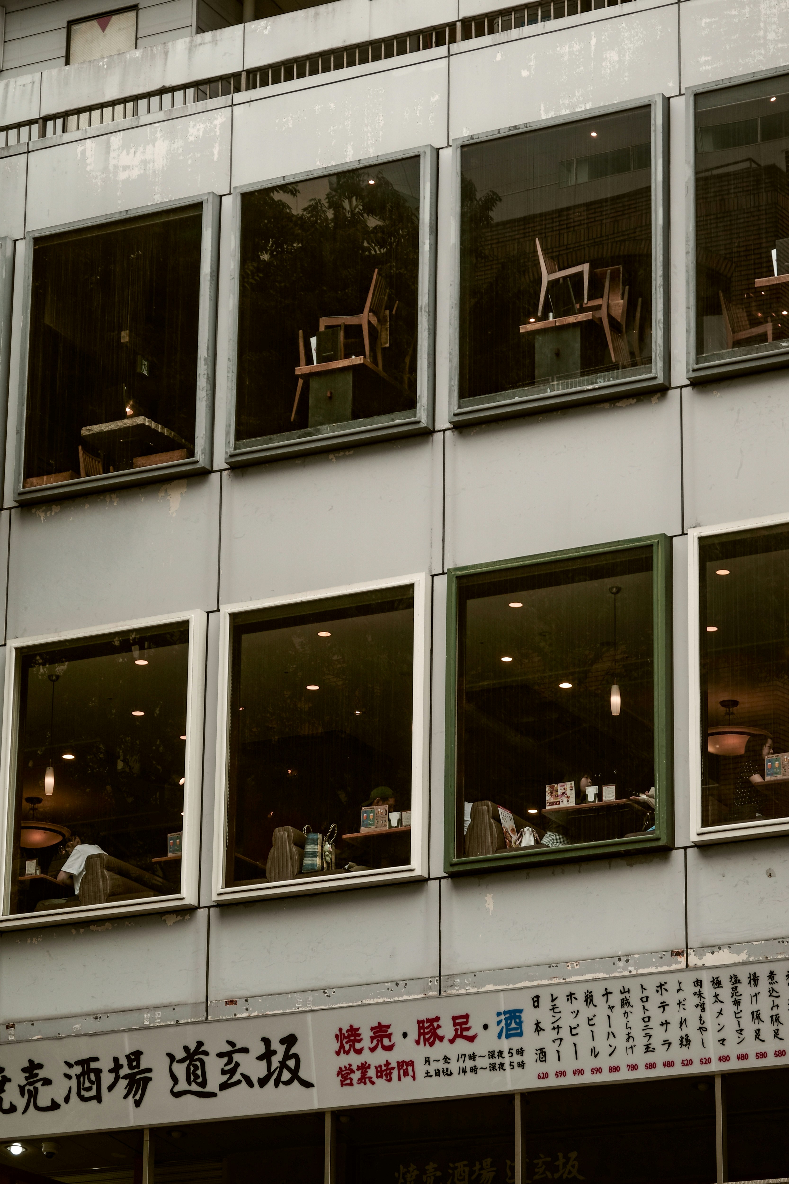 building exterior with windows and cityscape