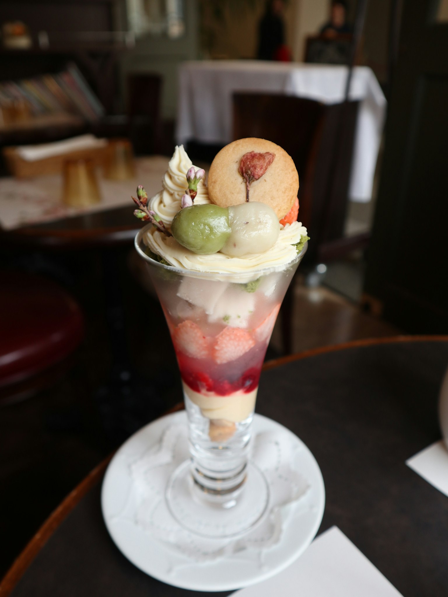 A beautifully arranged dessert parfait with layers of fruit and cream