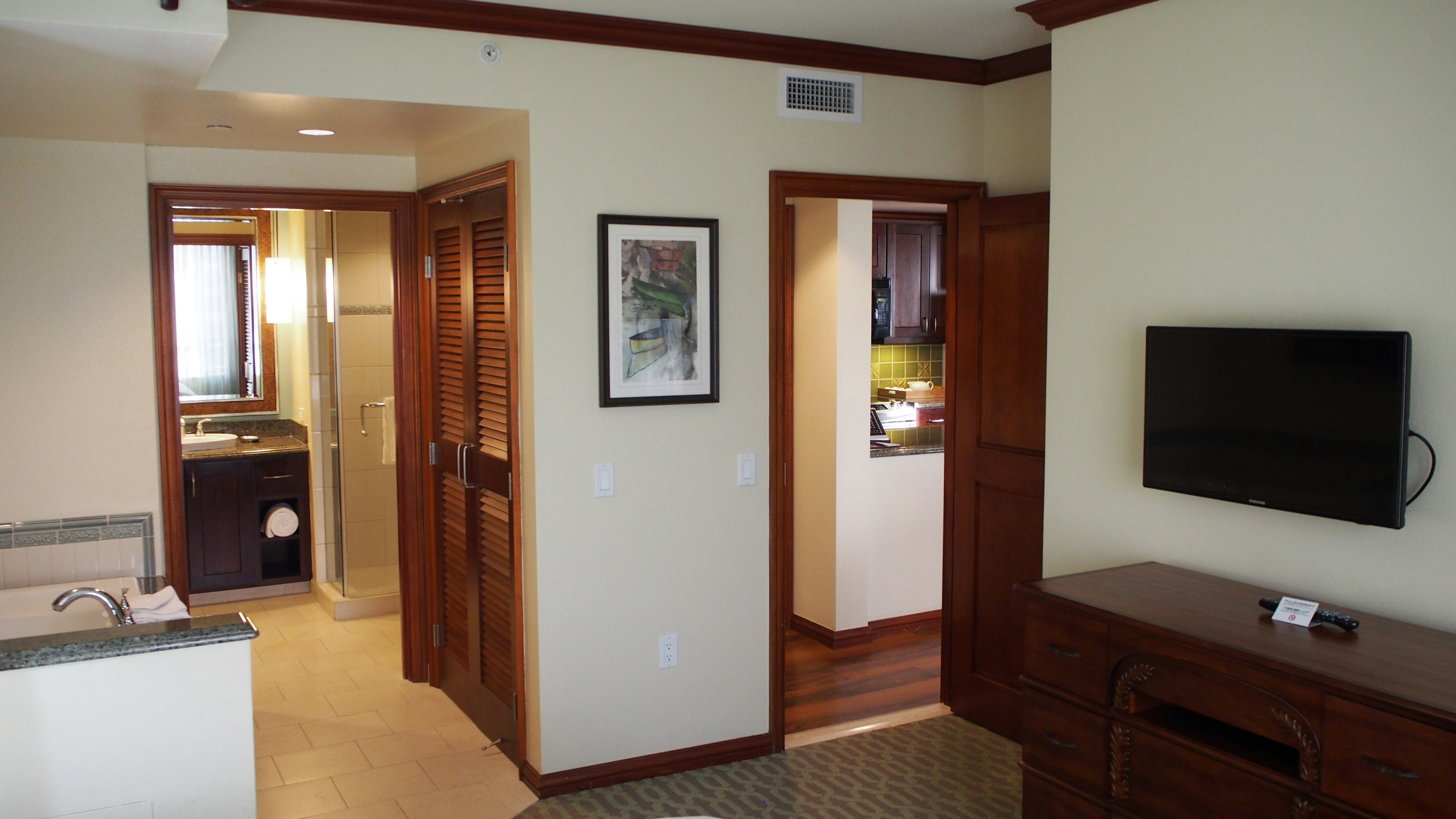 wood-paneled hallway leading to a living area image