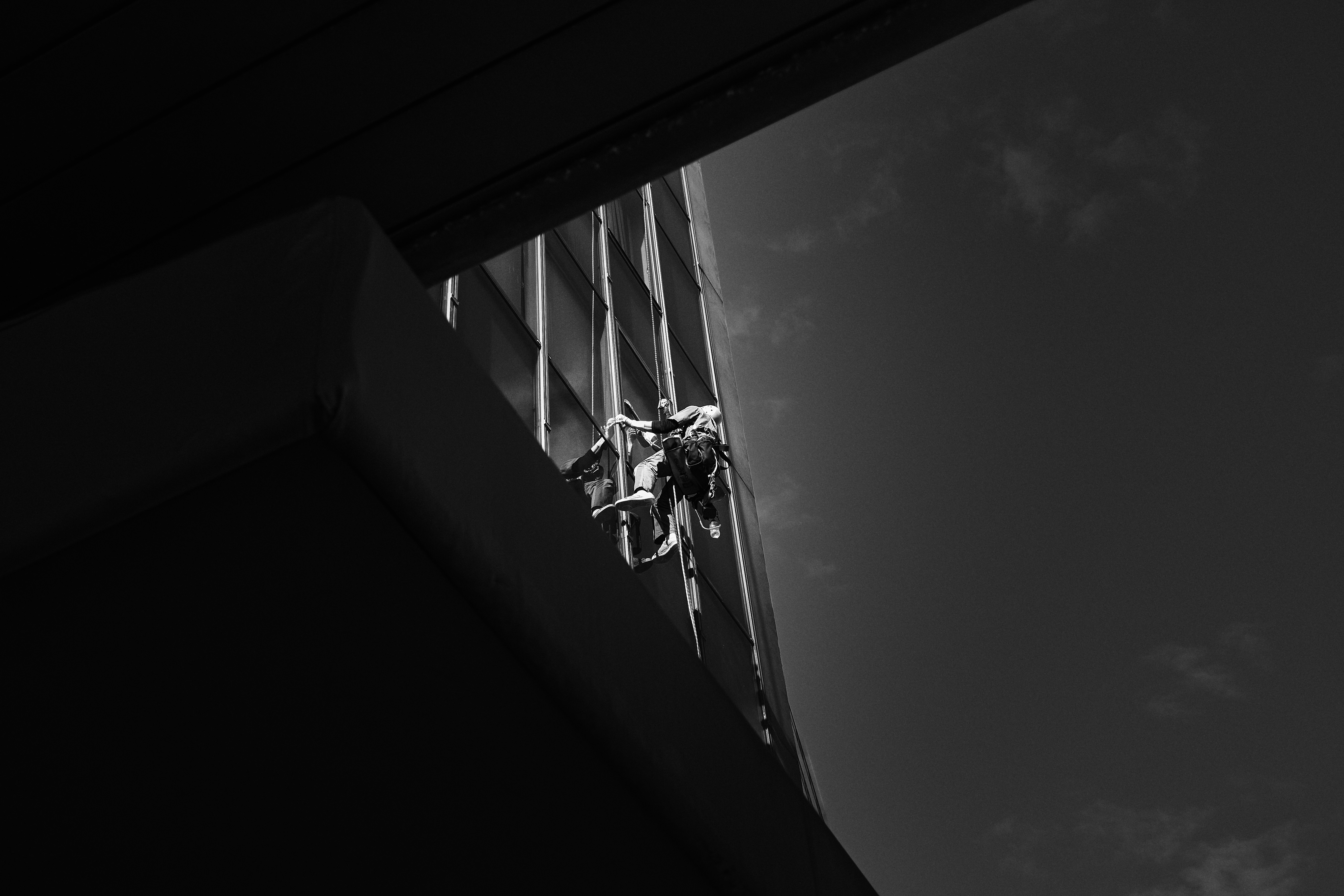 window frame with metal beams and wiring seen through shadows