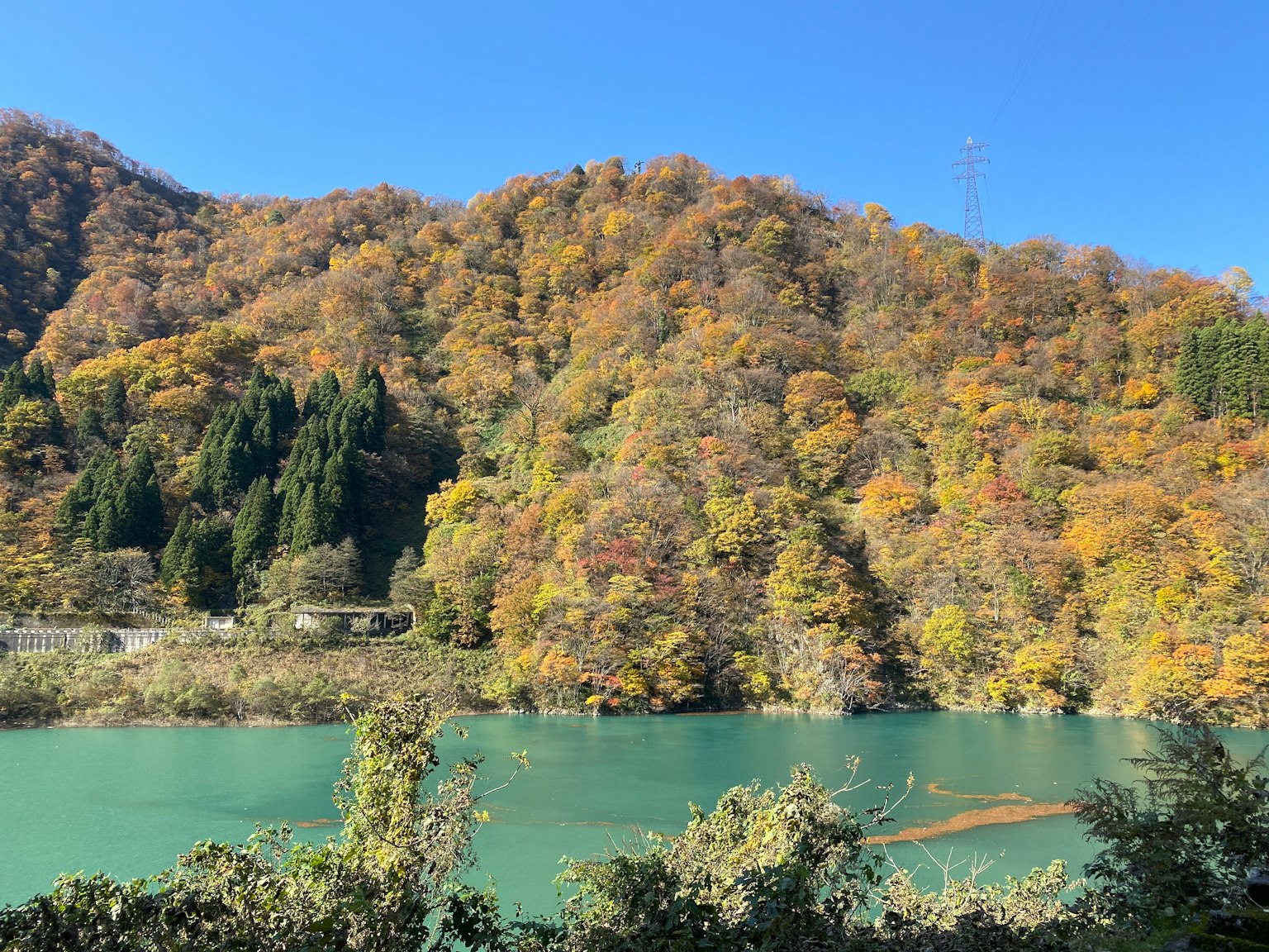 Scenic view of autumn mountains and a blue river