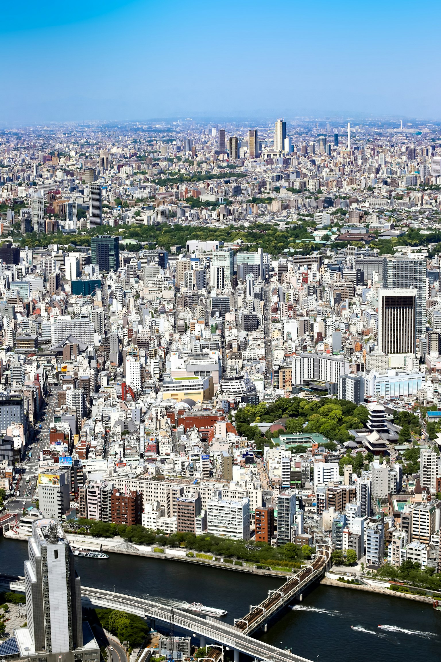 Aerial view of Tokyo showcasing skyscrapers and a river