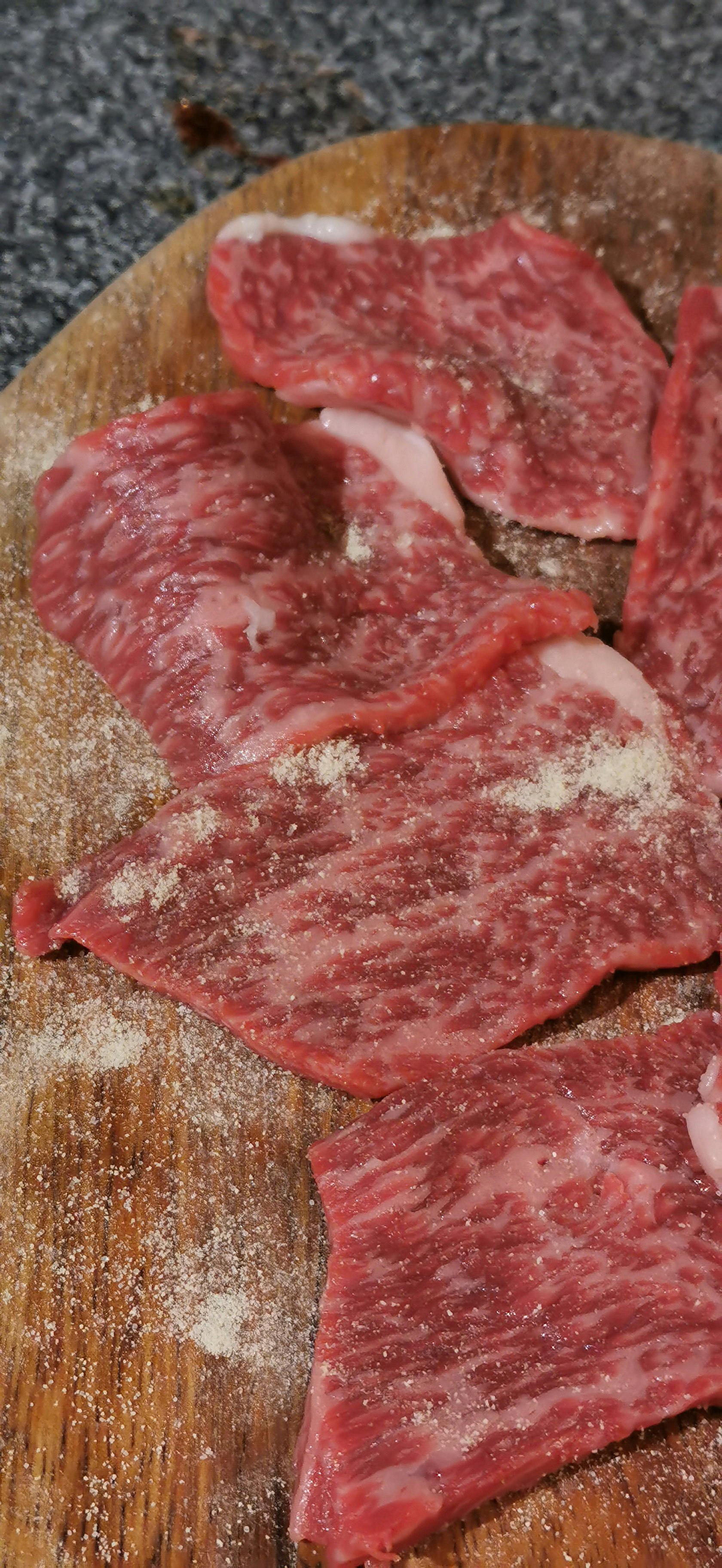 sliced red meat on a cutting board