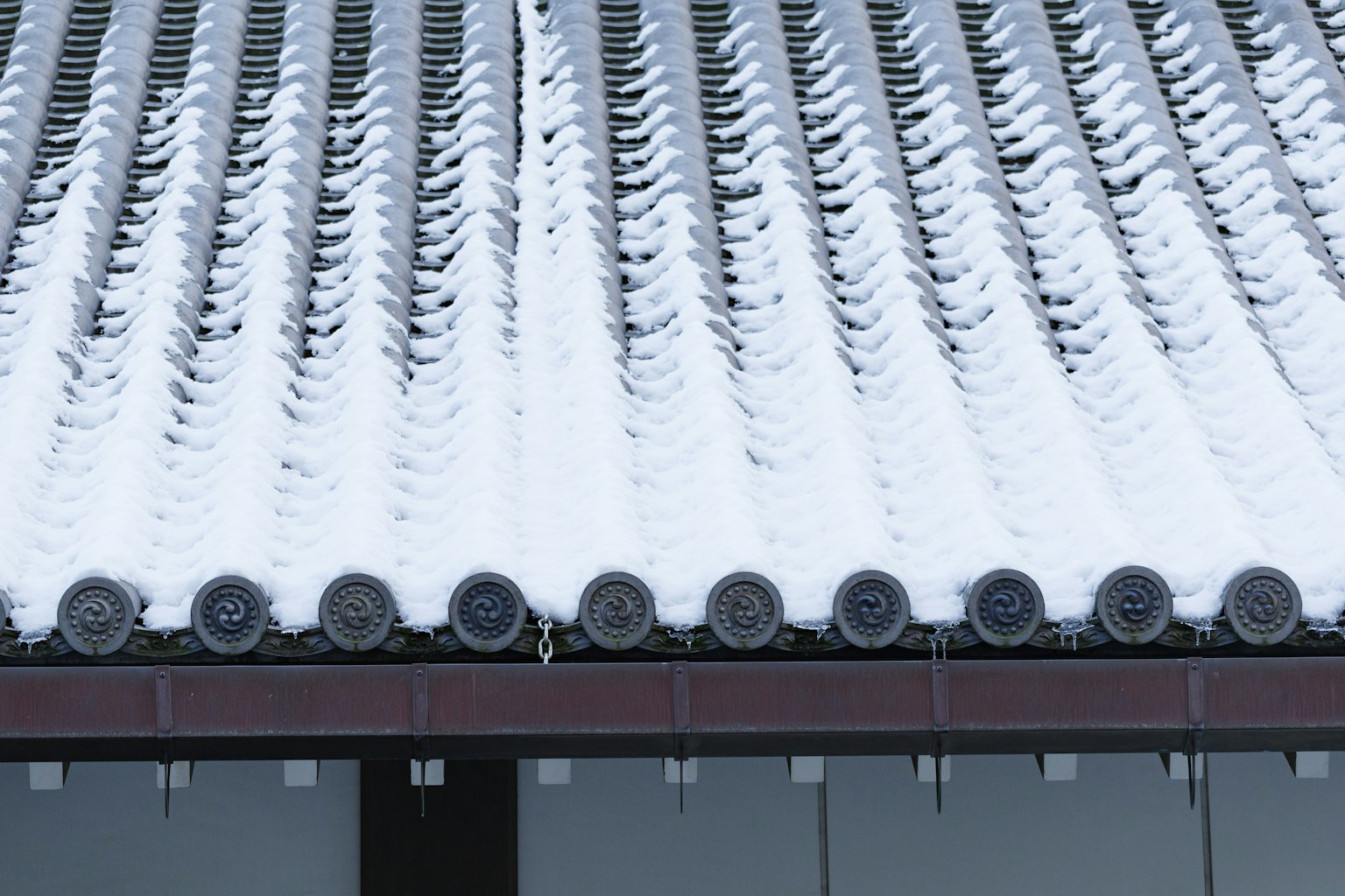 Traditional Japanese roof covered with snow